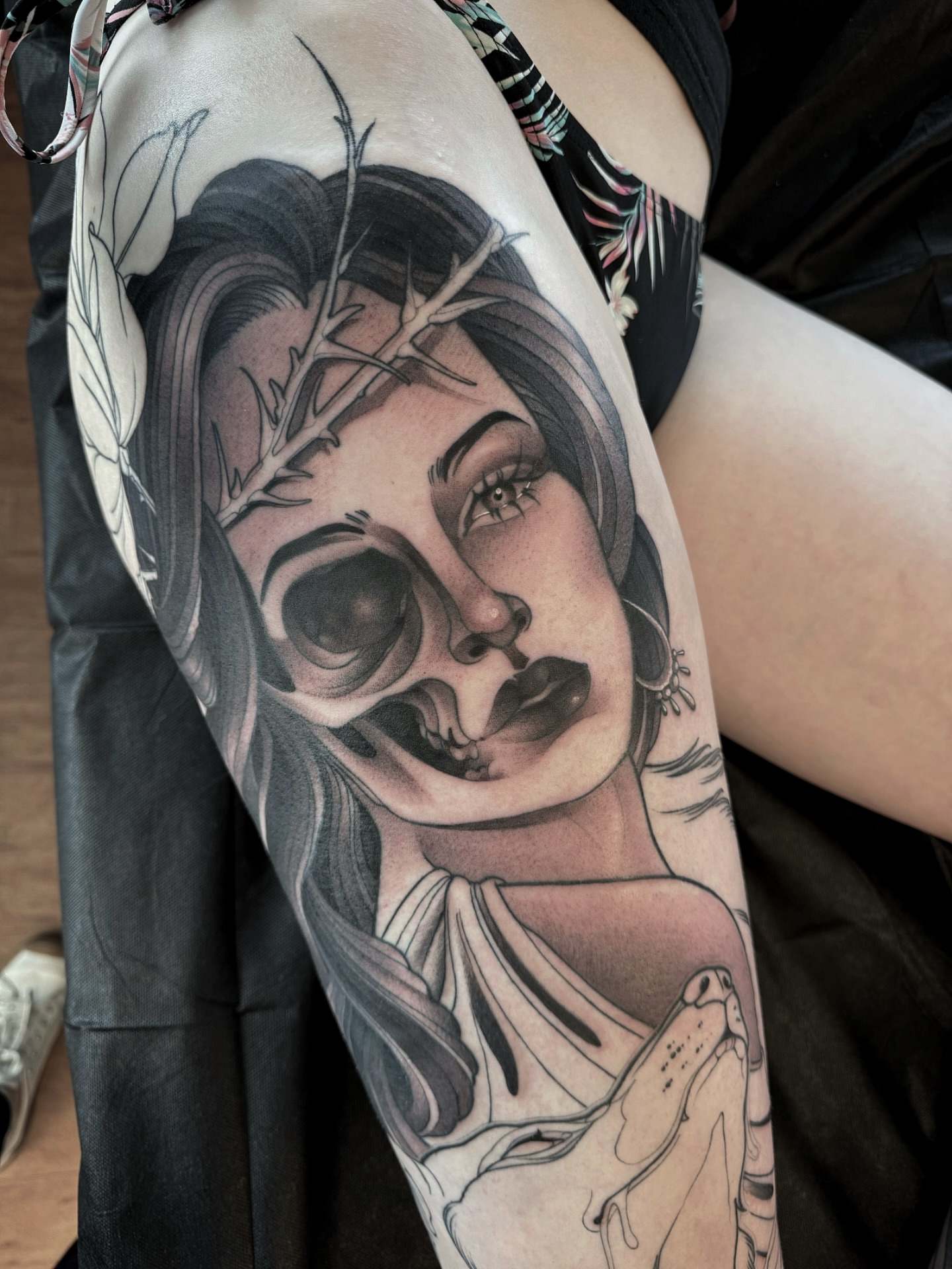 Woman with skull realism tattoo on the forearm by Anne Cornelson