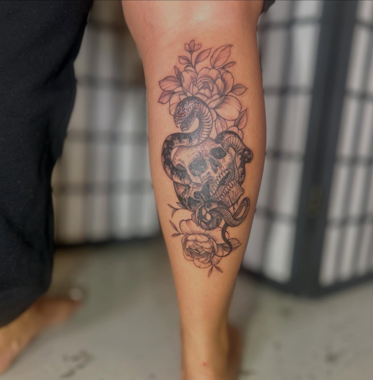 Snake and skull realism tattoo on the forearm by ɢɢ sᴛʏʟᴇs