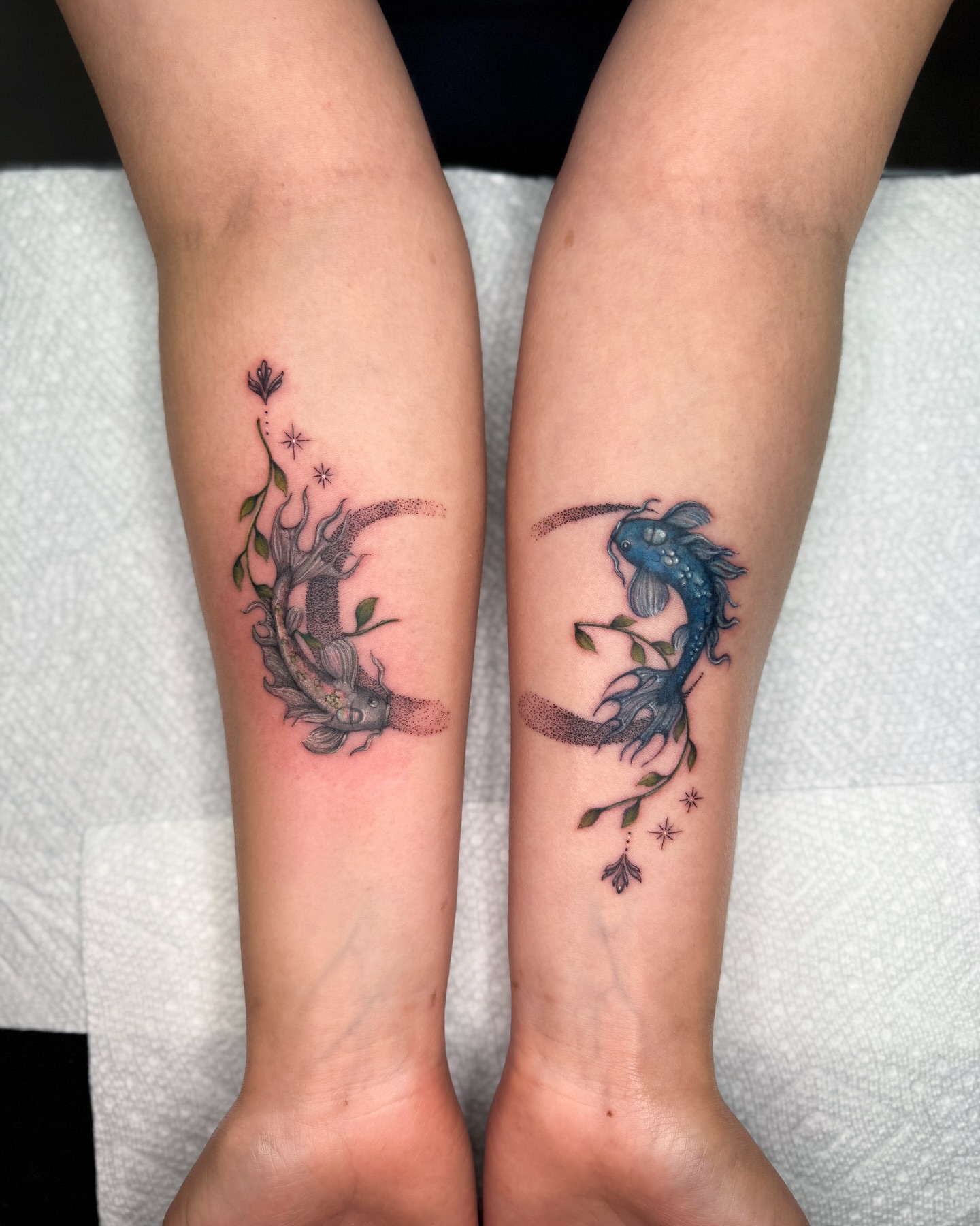 Koi fish and plant dotwork tattoo on the forearm by Natasha Rachel Fineline Tattoos Nashville