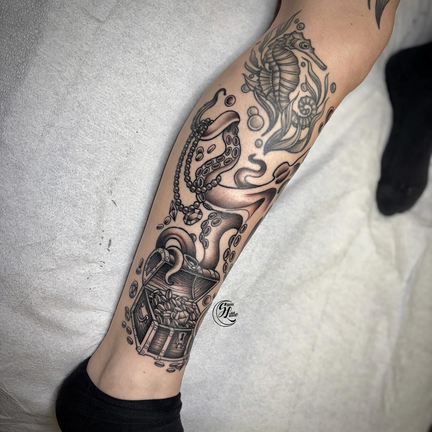 Treasure chest and octopus realism tattoo on the forearm by 𝓢𝓪𝓶 𝓛𝓲𝓽𝓽𝓵𝓮