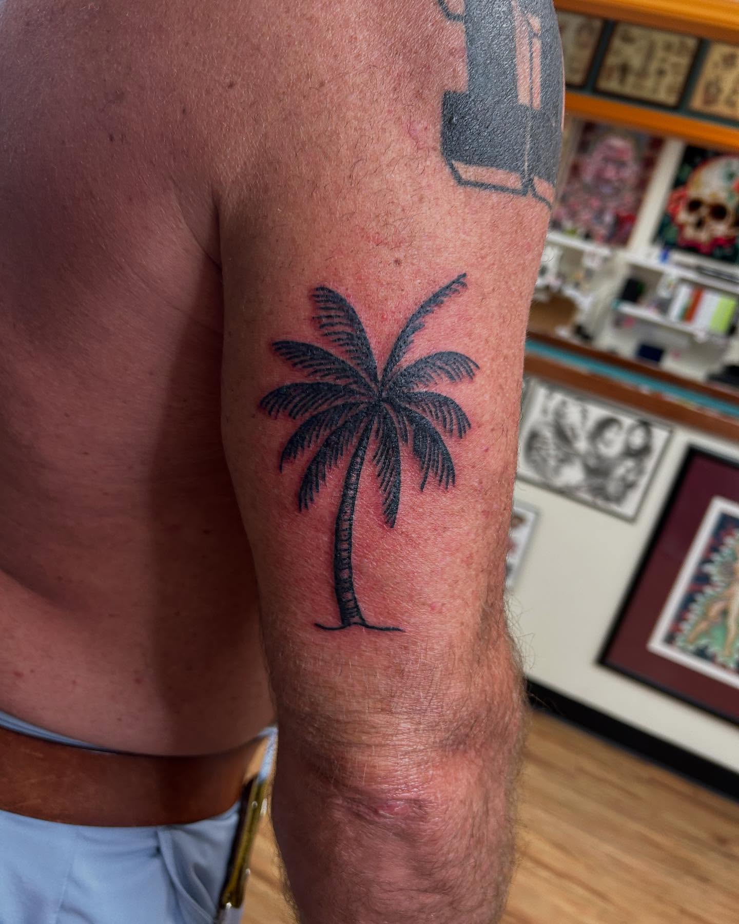 Palm tree black and grey tattoo on the forearm by Elizabeth Niederkorn