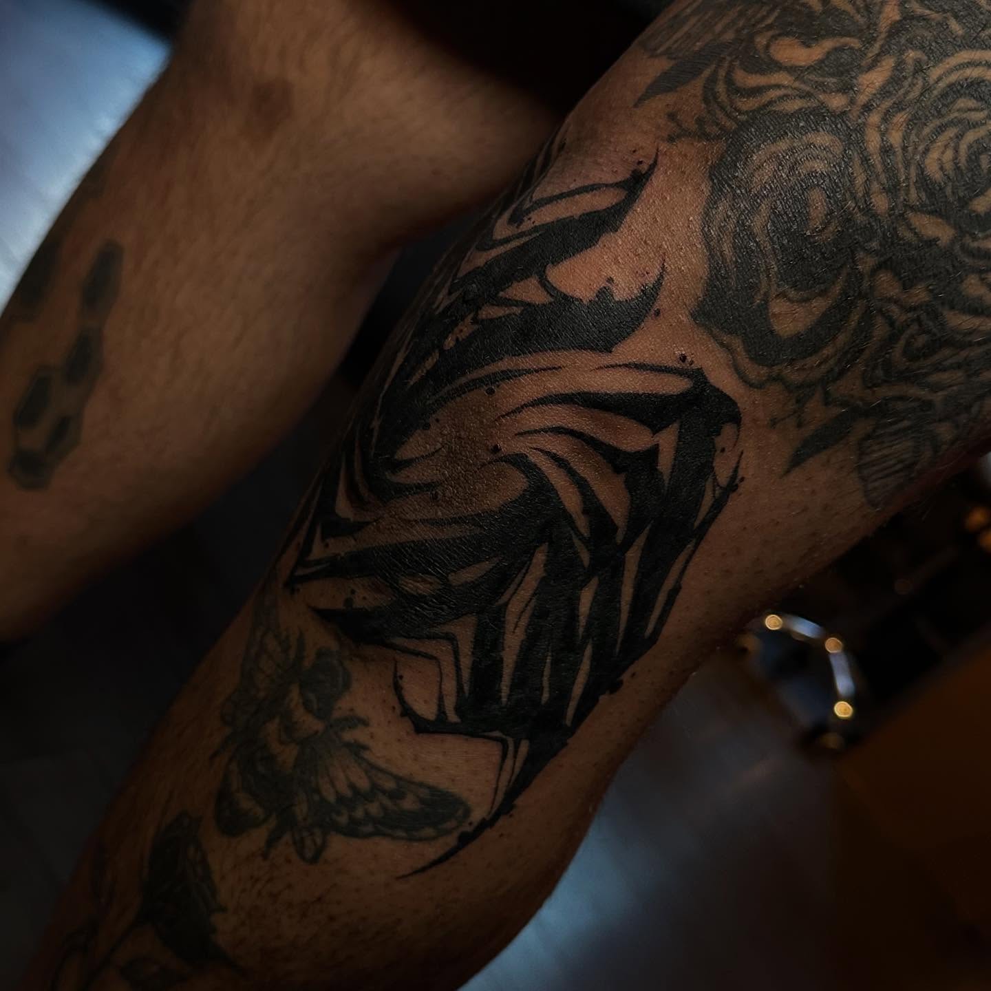 Abstract design black and grey tattoo on the forearm by Abigail Rae