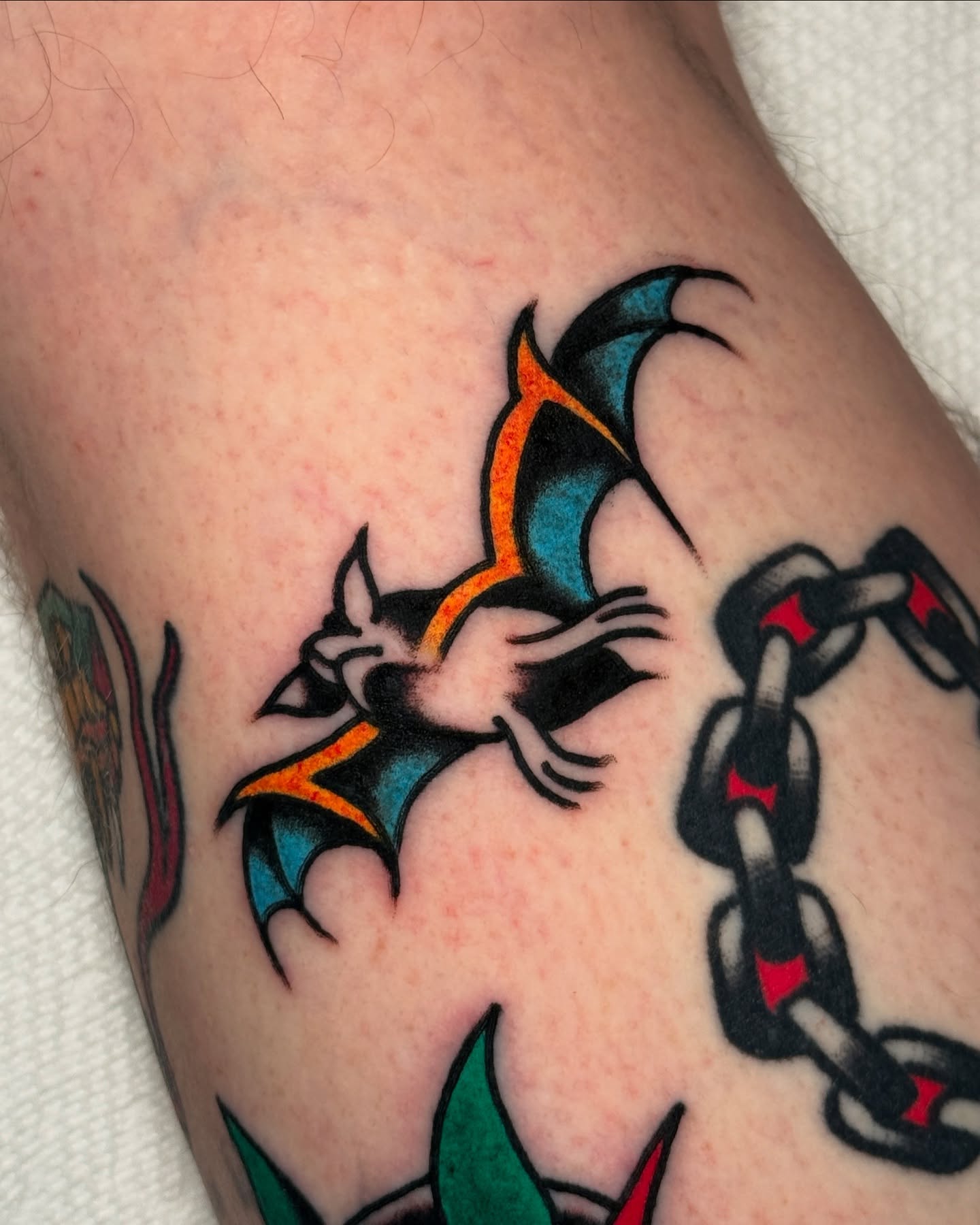 Bat and chain American traditional tattoo on the forearm by οΌππ¨ππ¨οΌ, New York, New York