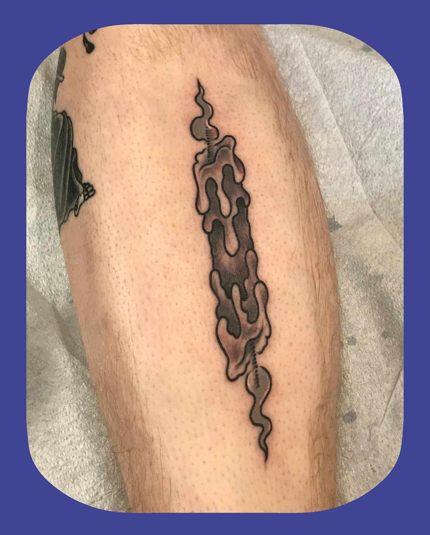 Smoke black and grey tattoo on the forearm by Chris Chapman