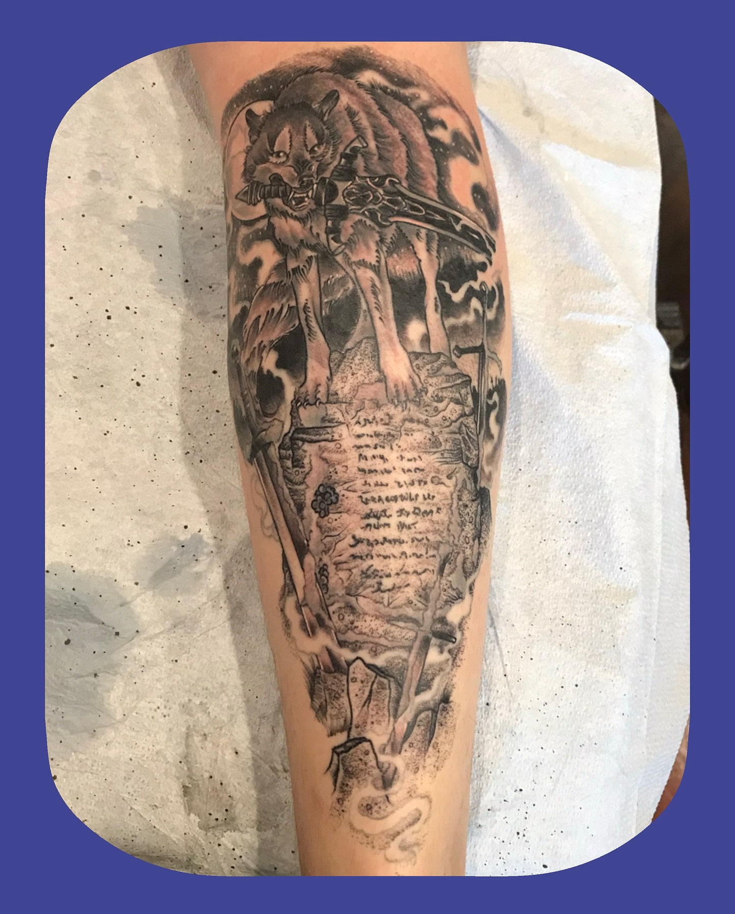 Lion and scroll realism tattoo on the forearm by Chris Chapman
