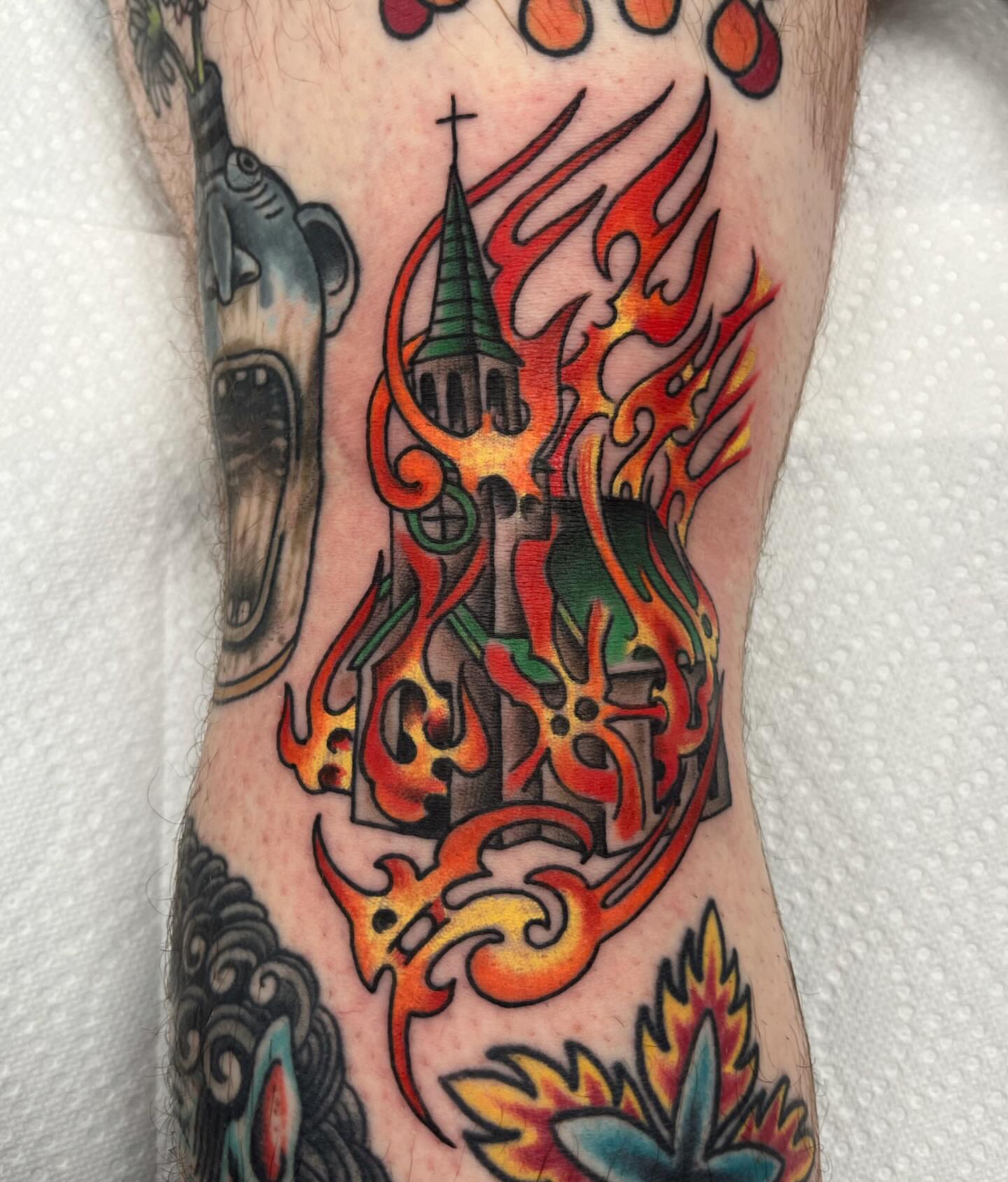 Flame and church American traditional tattoo on the forearm by Brian Mcfadden
