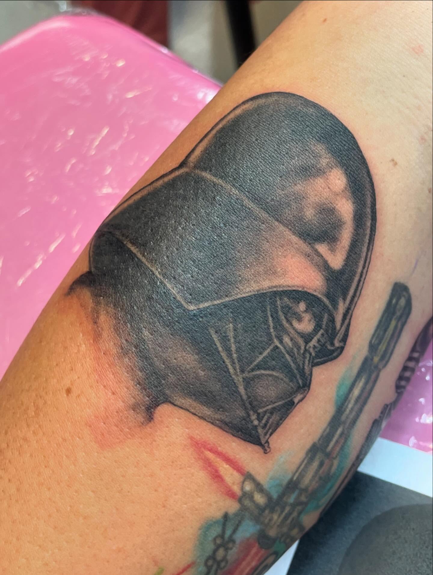 Darth vader helmet black and grey tattoo on the forearm by Christin Baumgart