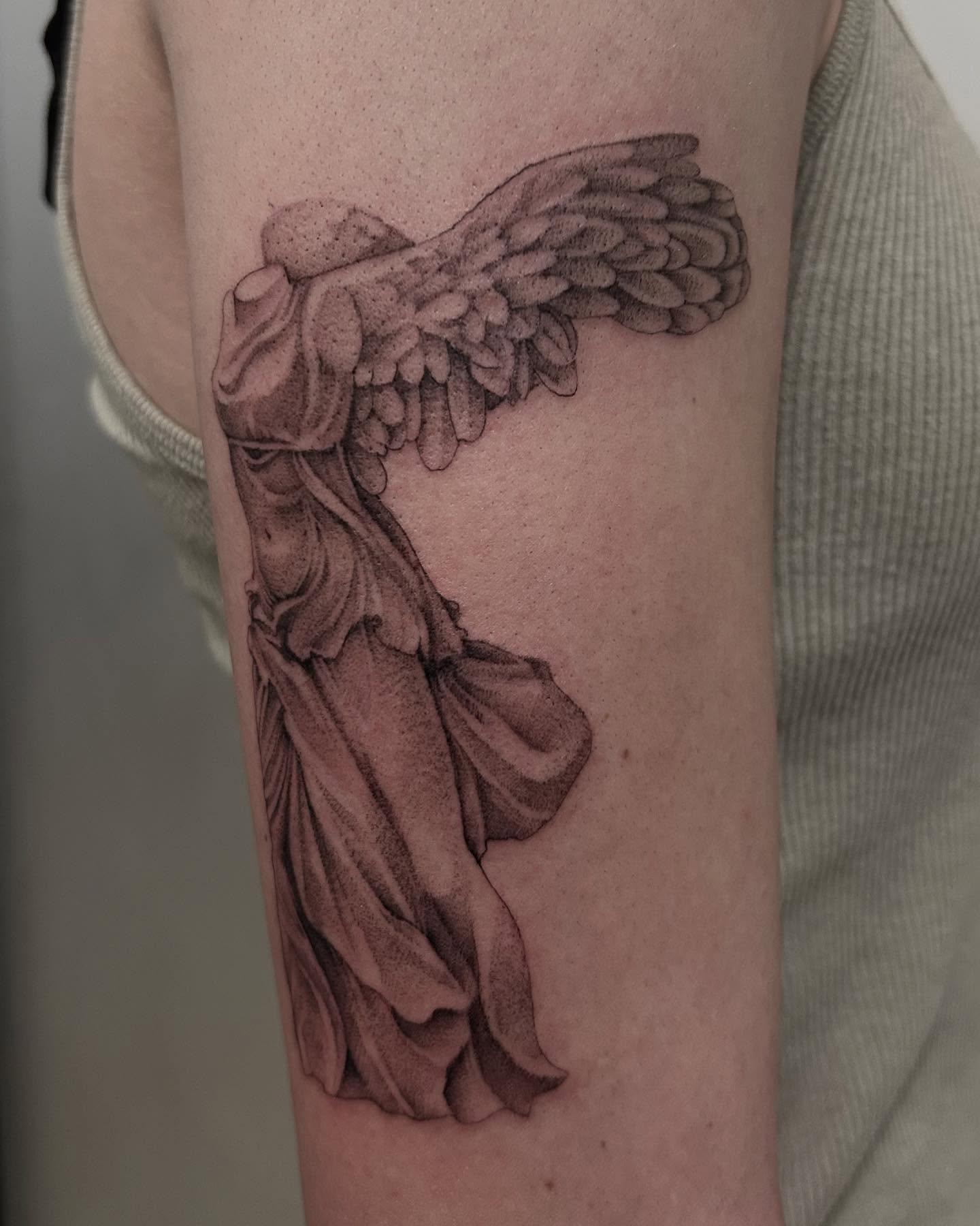 Winged female figure dotwork tattoo on the forearm by Olivia Fox