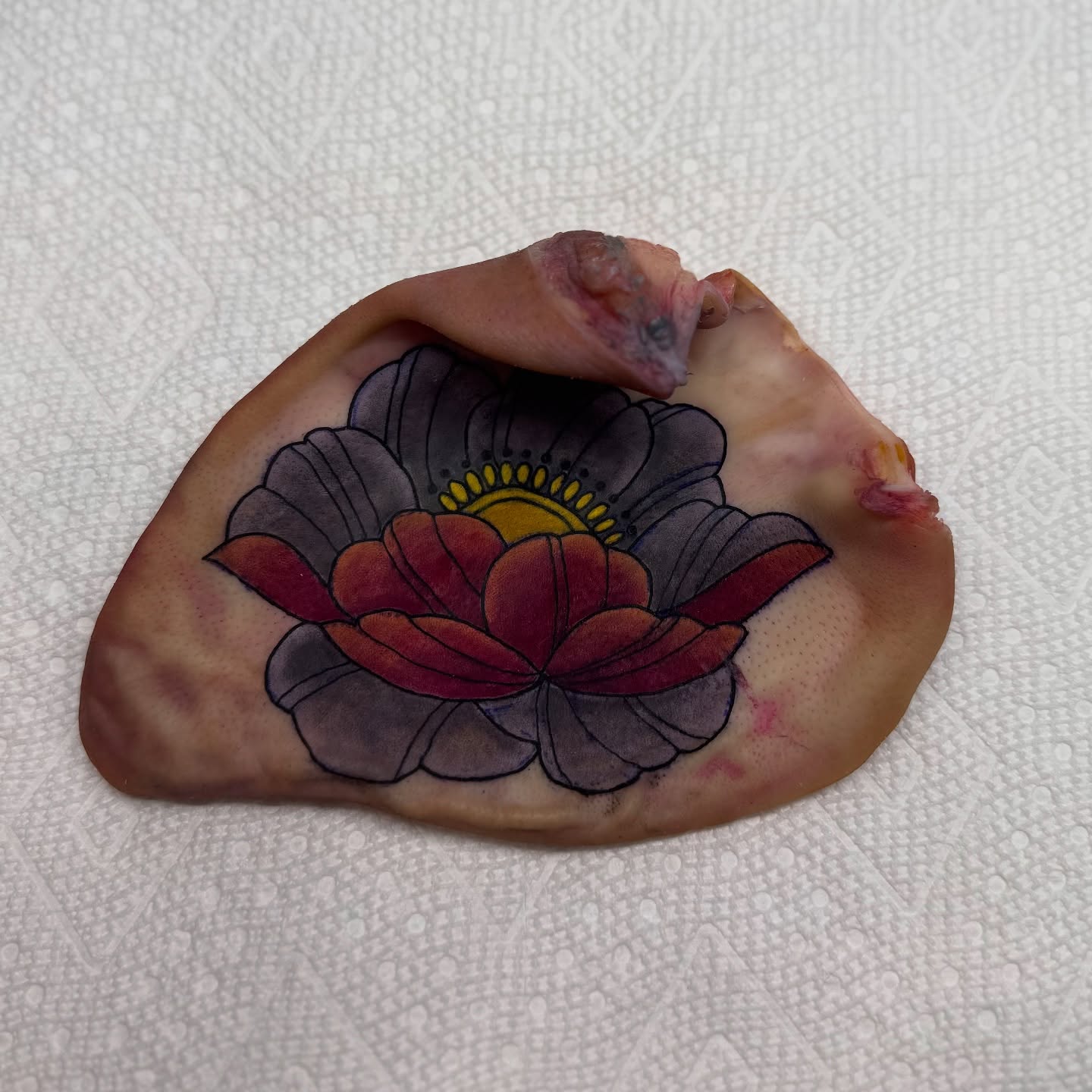 Lotus flower dotwork tattoo on the hand by Minxxy Tattoos