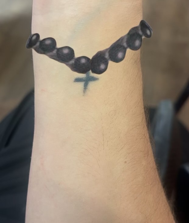 Rosary beads black and grey tattoo on the forearm by Ink by Hailey π