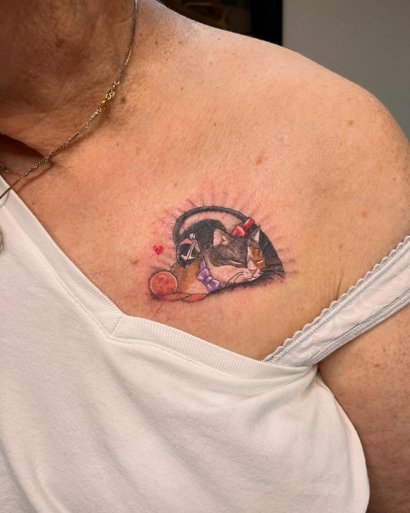 Cat realism tattoo on the chest by Katlyne Jones
