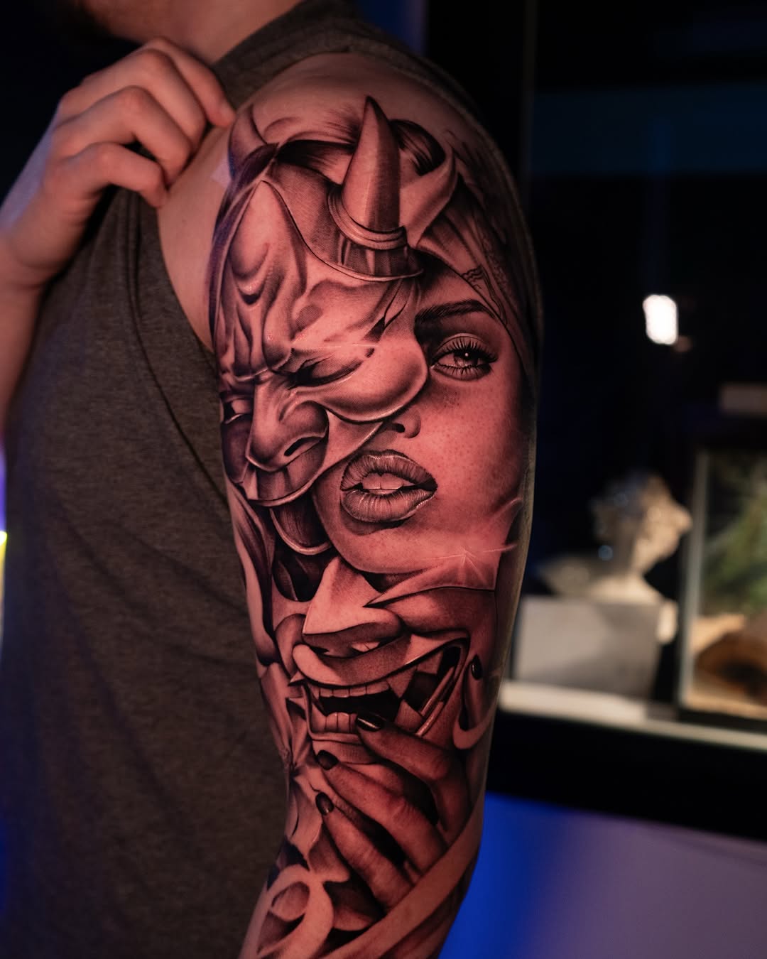 Realism tattoo on the upper arm by Apolo