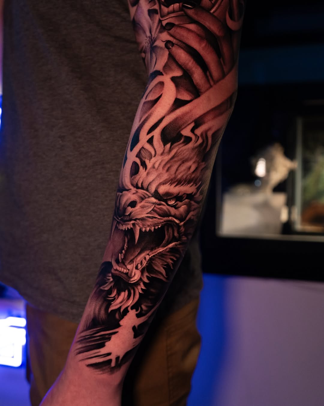 Dragon head with open mouth Japanese tattoo on the forearm by Apolo