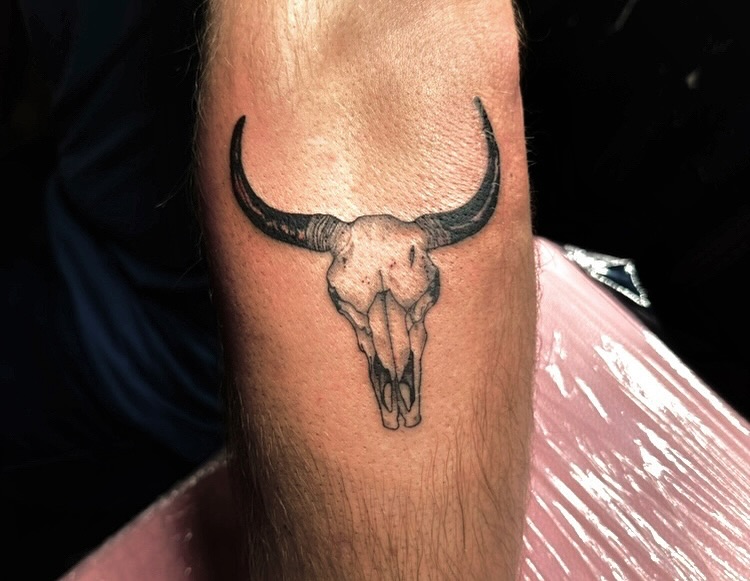 Bull skull black and grey tattoo on the forearm by V