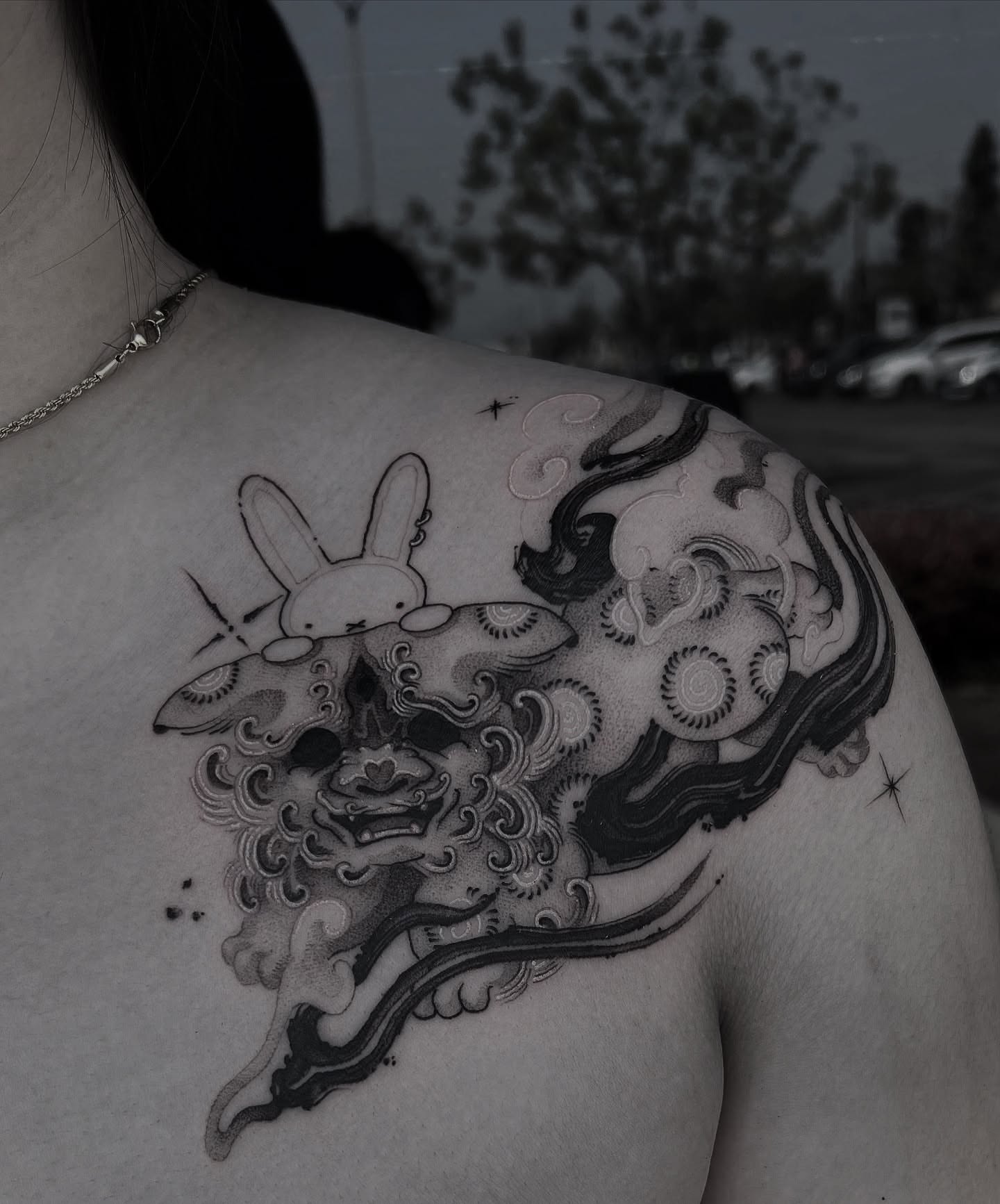 Rabbit and dragon illustrative tattoo on the shoulder by Joshua Hung, Alhambra, California