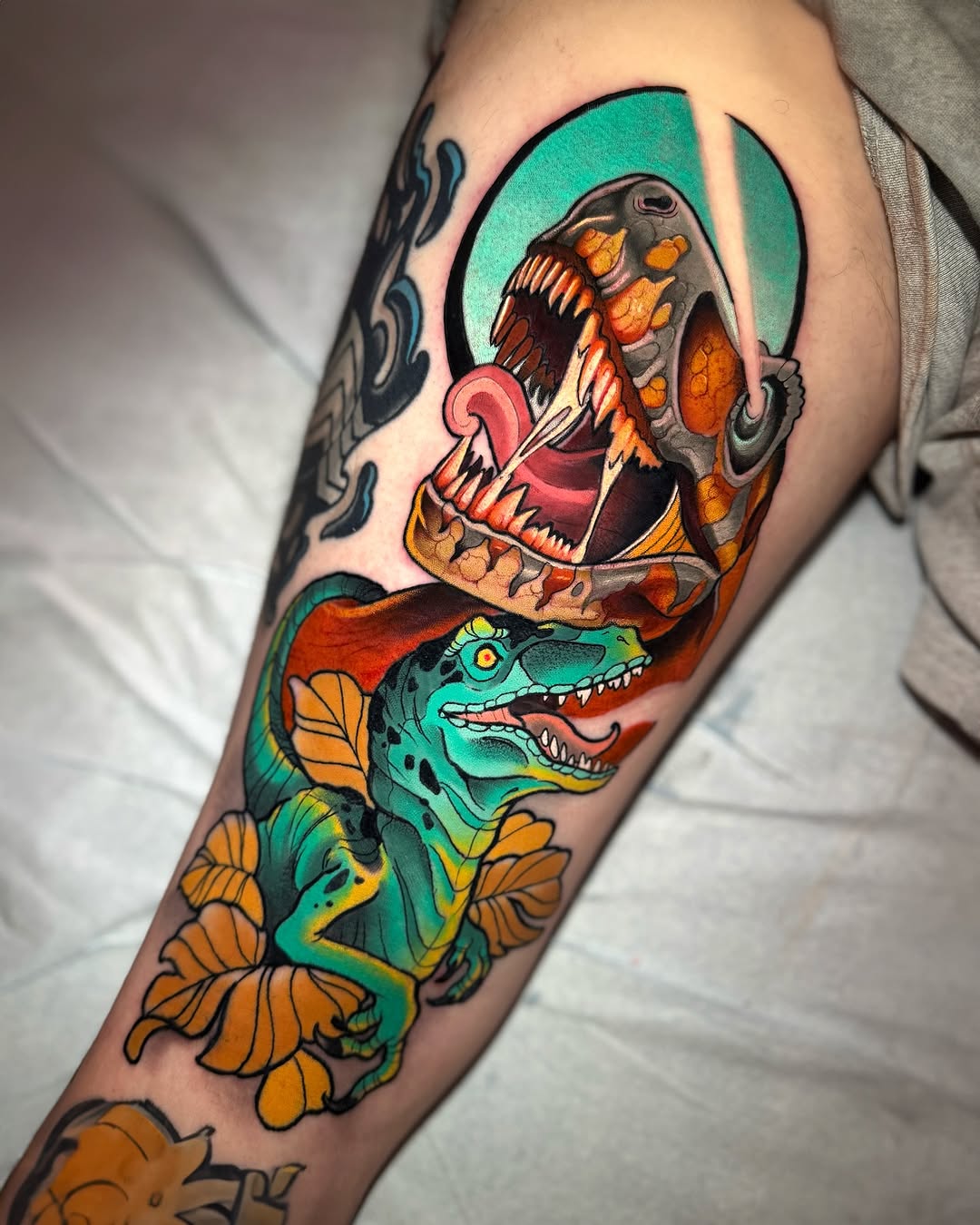 Dinosaur and skull American traditional tattoo on the forearm by Matt - Neotrad Tattoos, New York, New York