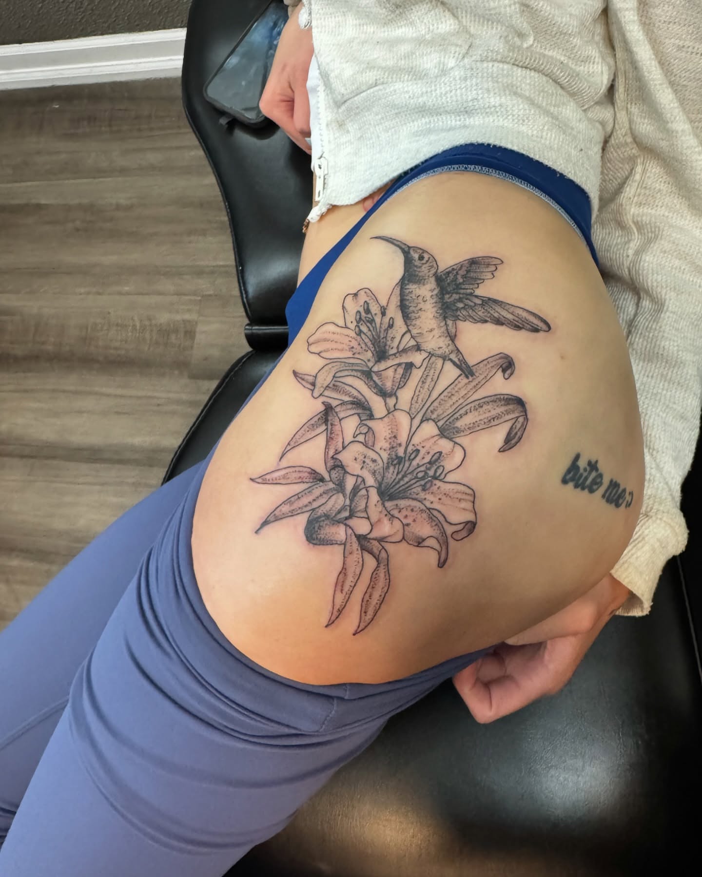 Lilies and hummingbird realism tattoo on the thigh by Lexy