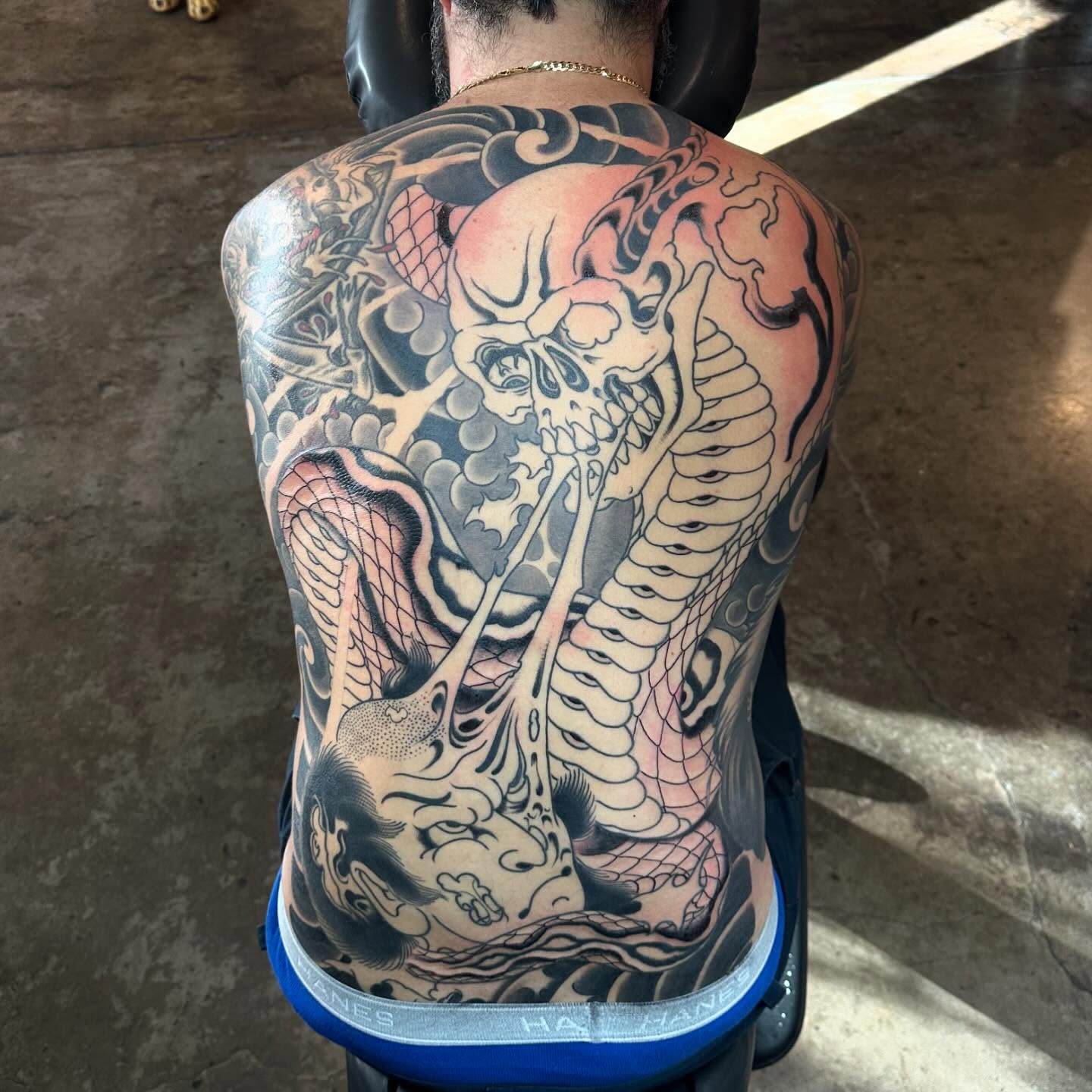 Skull and snake japanese irezumi tattoo on the back by Tony Medellin 7X9X