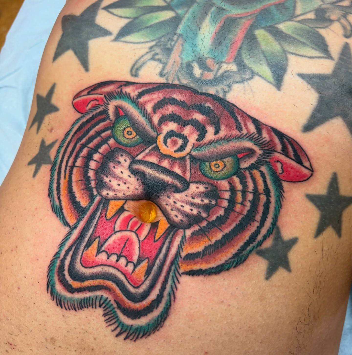Tiger head American traditional tattoo on the thigh by adamsayre, San Diego, California