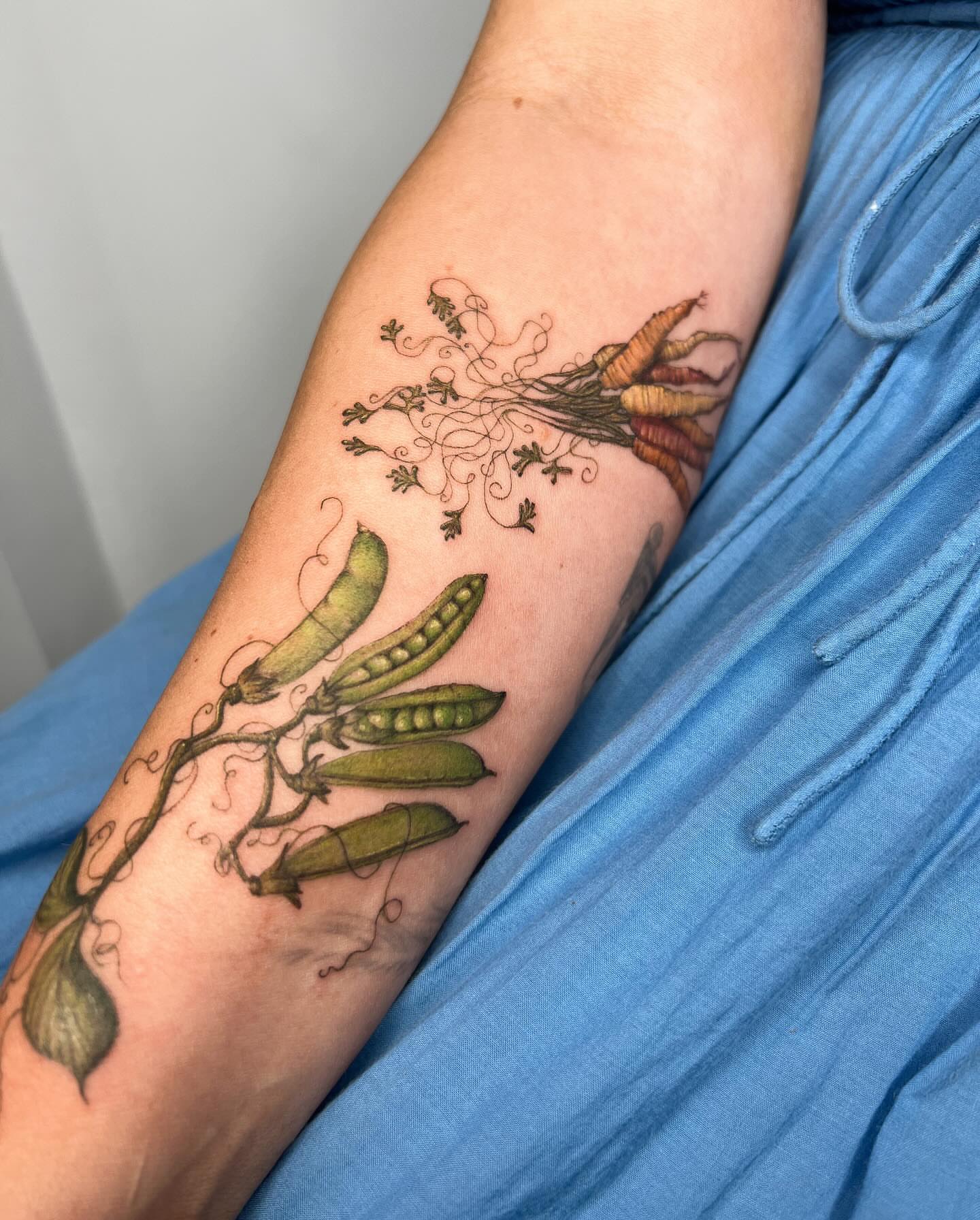 Peas and carrots realism tattoo on the forearm by Natasha Rachel Fineline Tattoos Nashville