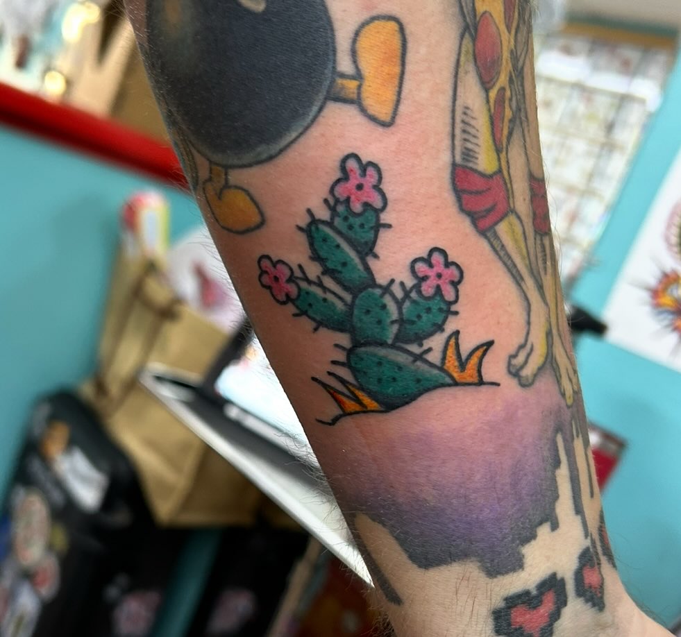 Cactus with flowers American traditional tattoo on the forearm by Elizabeth Niederkorn