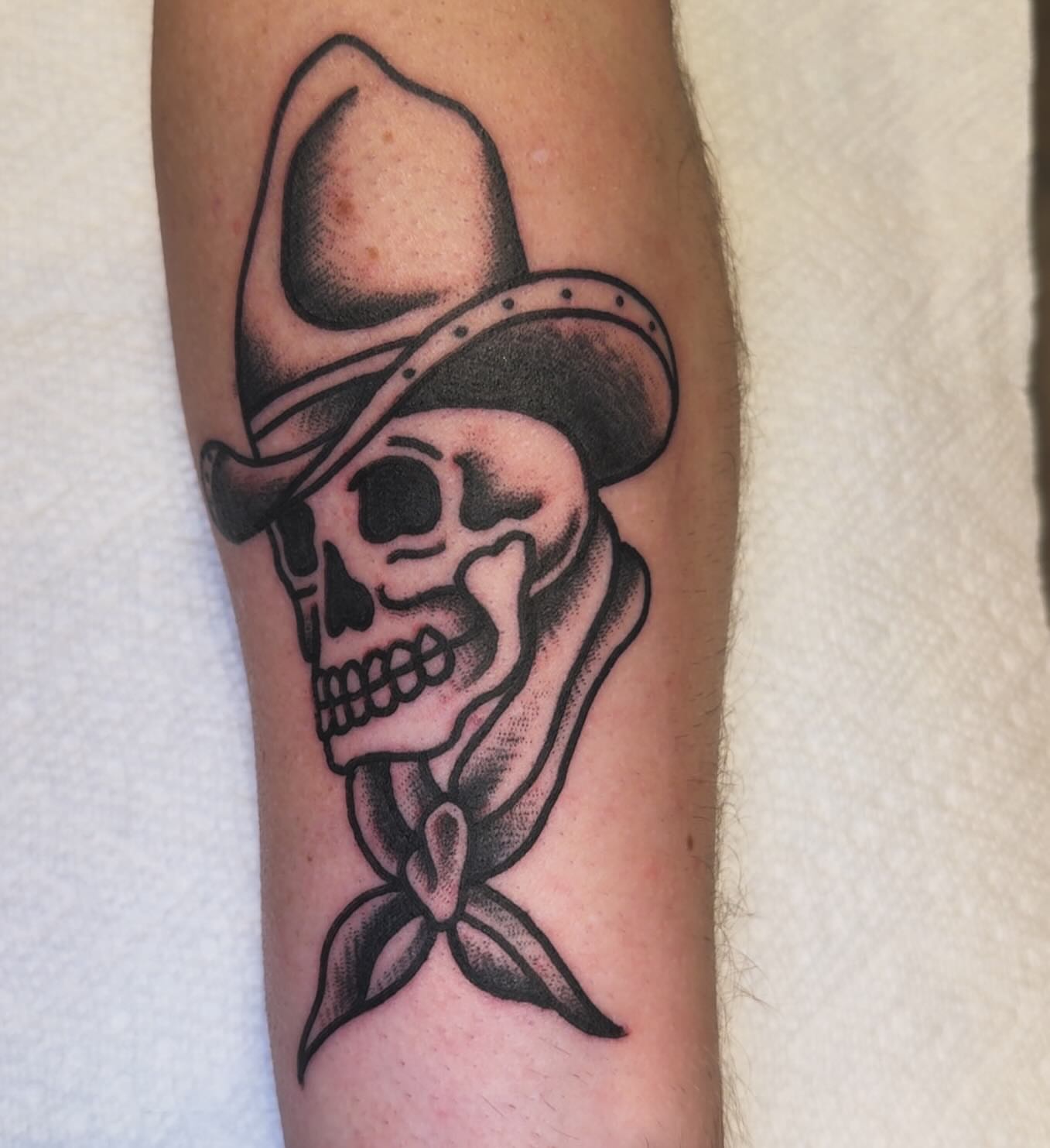 Cowboy skull black and grey tattoo on the forearm by Rob Keiuf