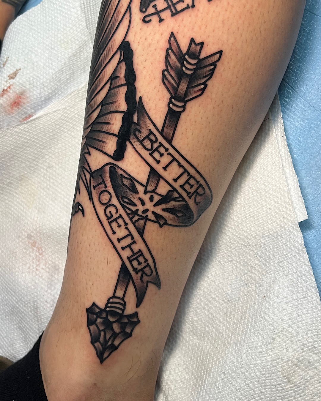 Arrow and shield black and grey tattoo on the forearm by @shannonkeeleyy