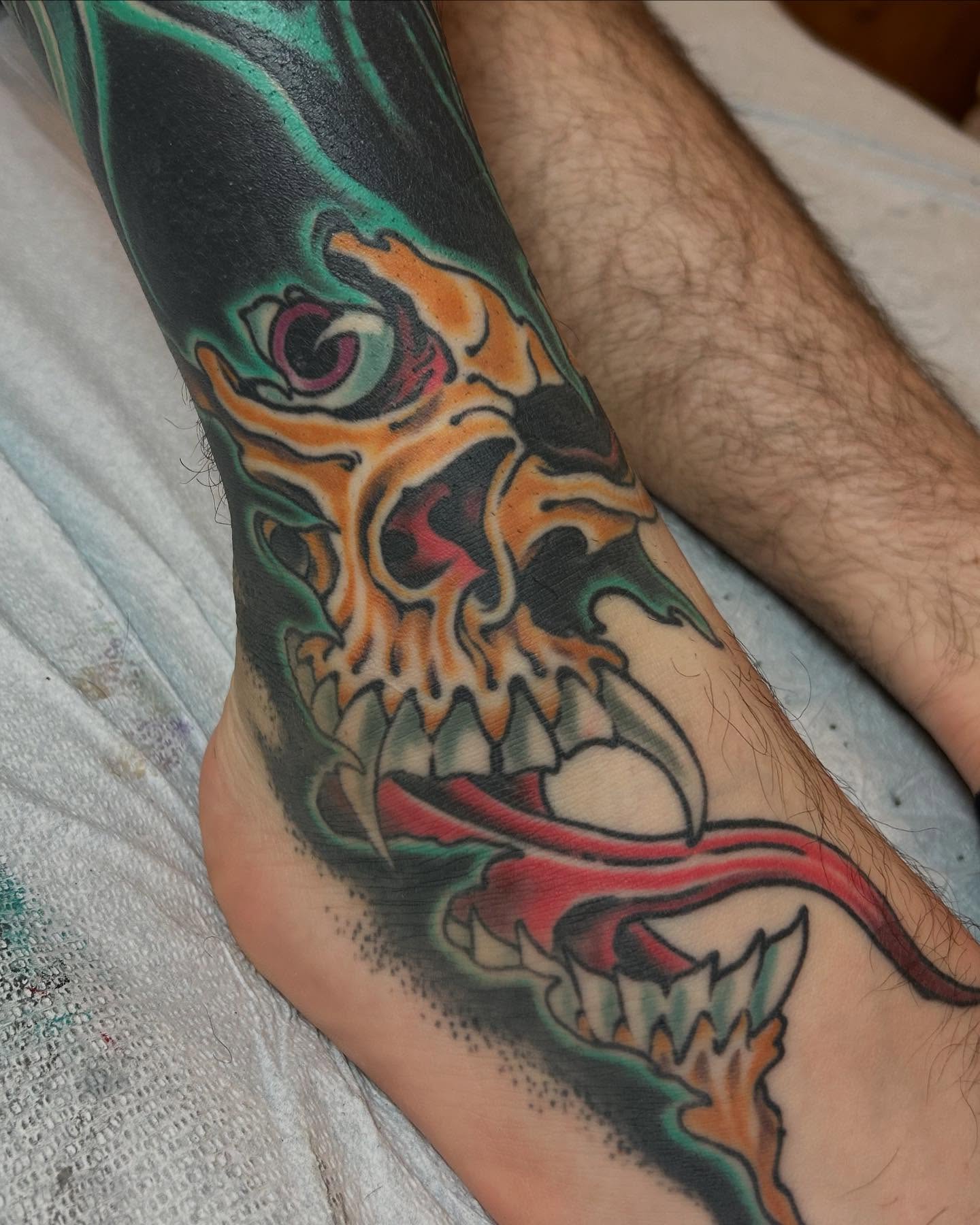 Skull American traditional tattoo on the calf by Craig Gardyan