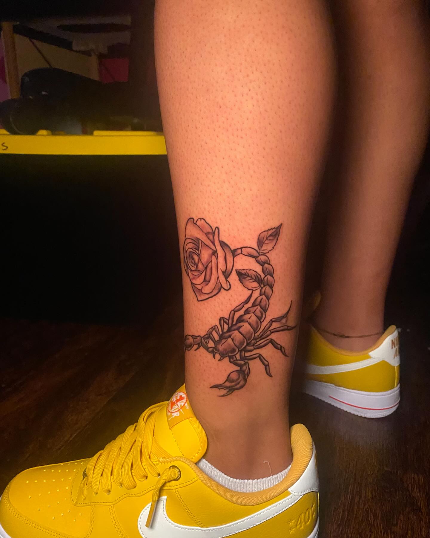 Scorpion and rose black and grey tattoo on the calf by Glass Inkk