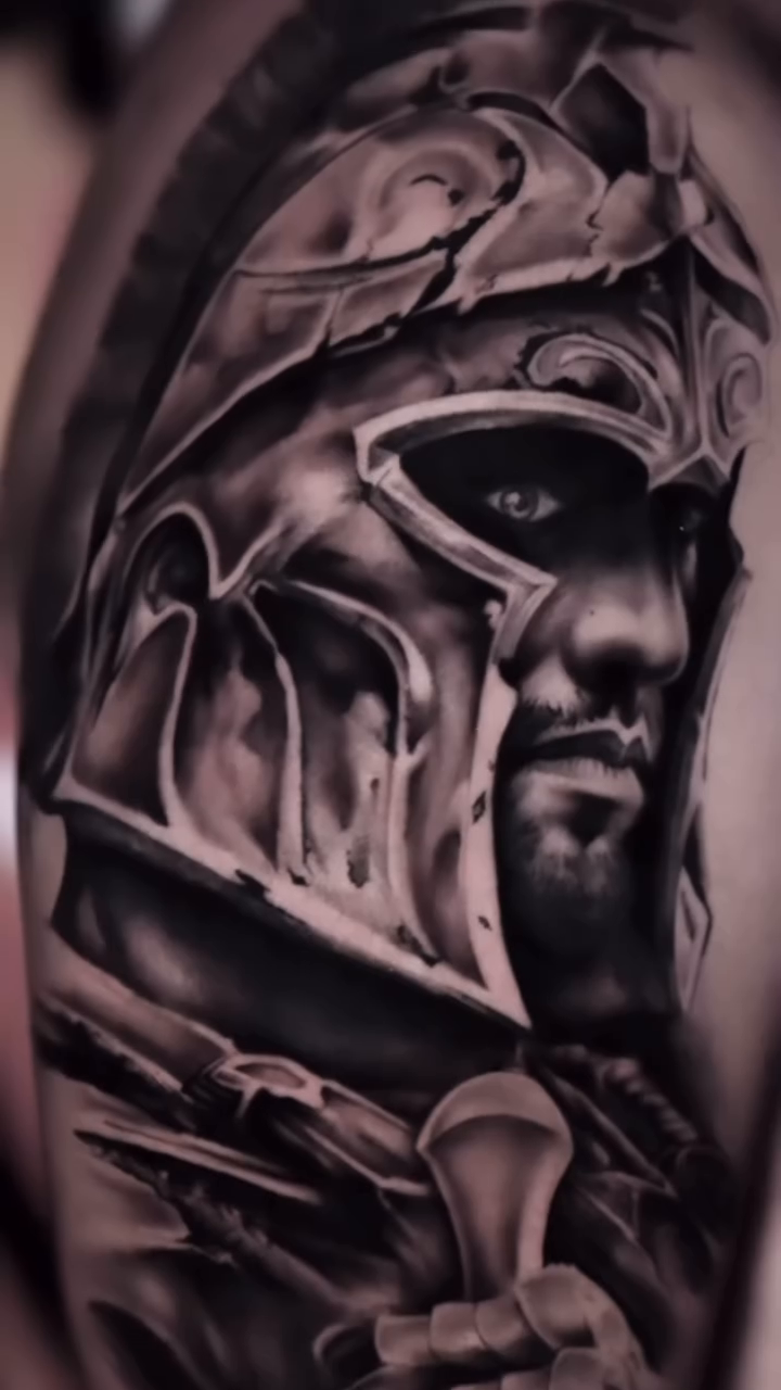 Spartan warrior helmet realism tattoo by Kiefer Fonseca