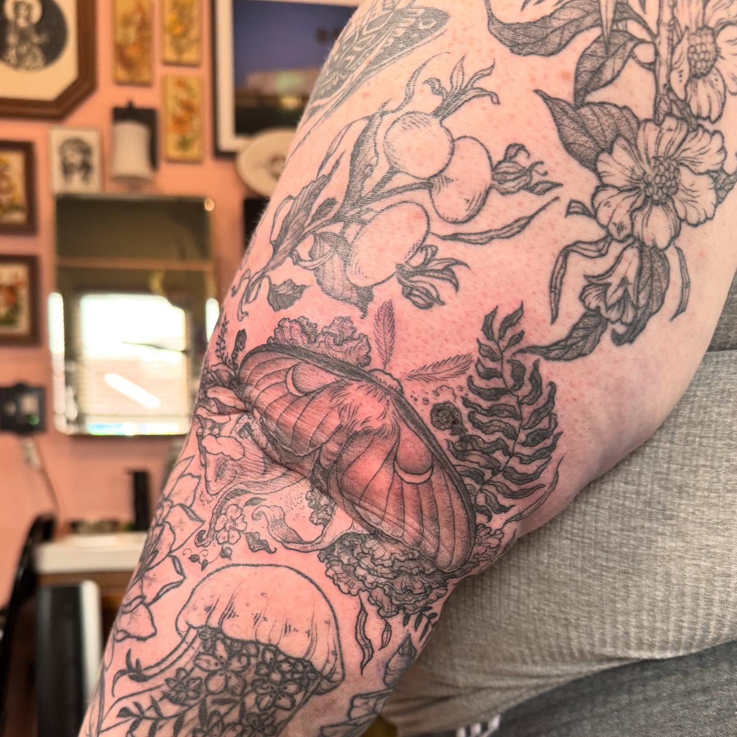 Botanical and insect black and grey tattoo on the forearm by Rebeka Chase [Sobodacha]