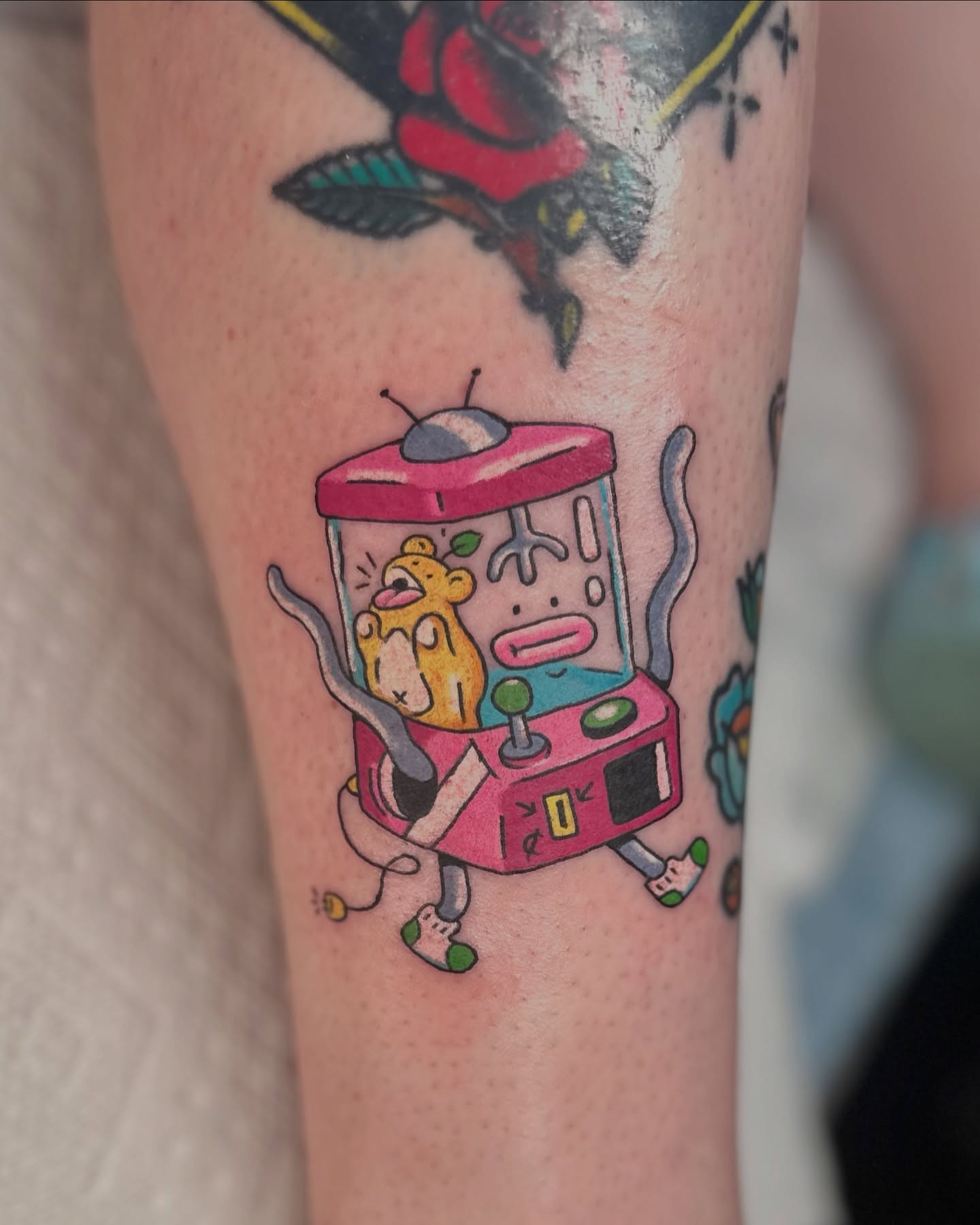 Gumball machine new school tattoo on the forearm by Kellie Burch