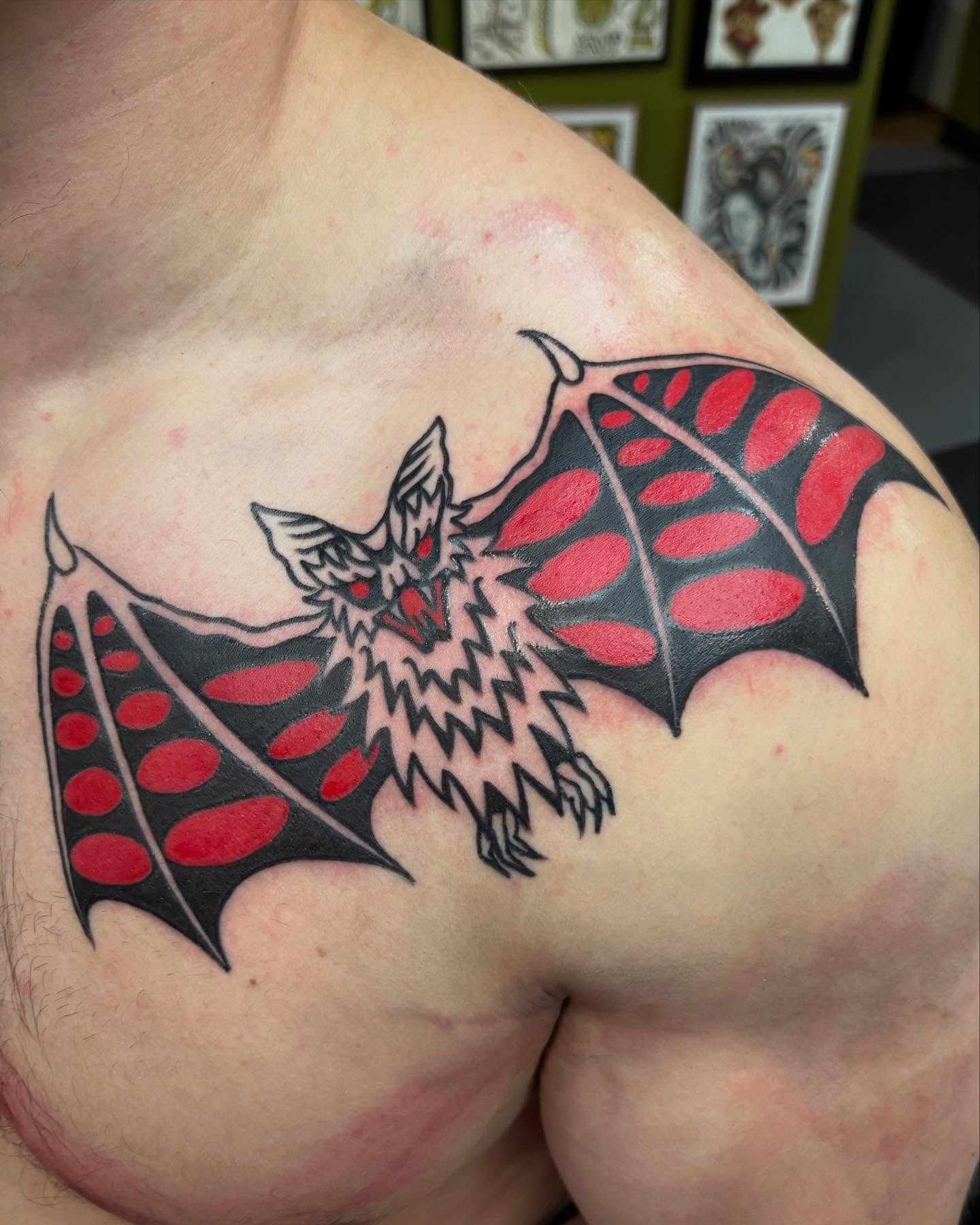Bat trash polka tattoo on the shoulder by Jamie Yuu, Minneapolis, Minnesota