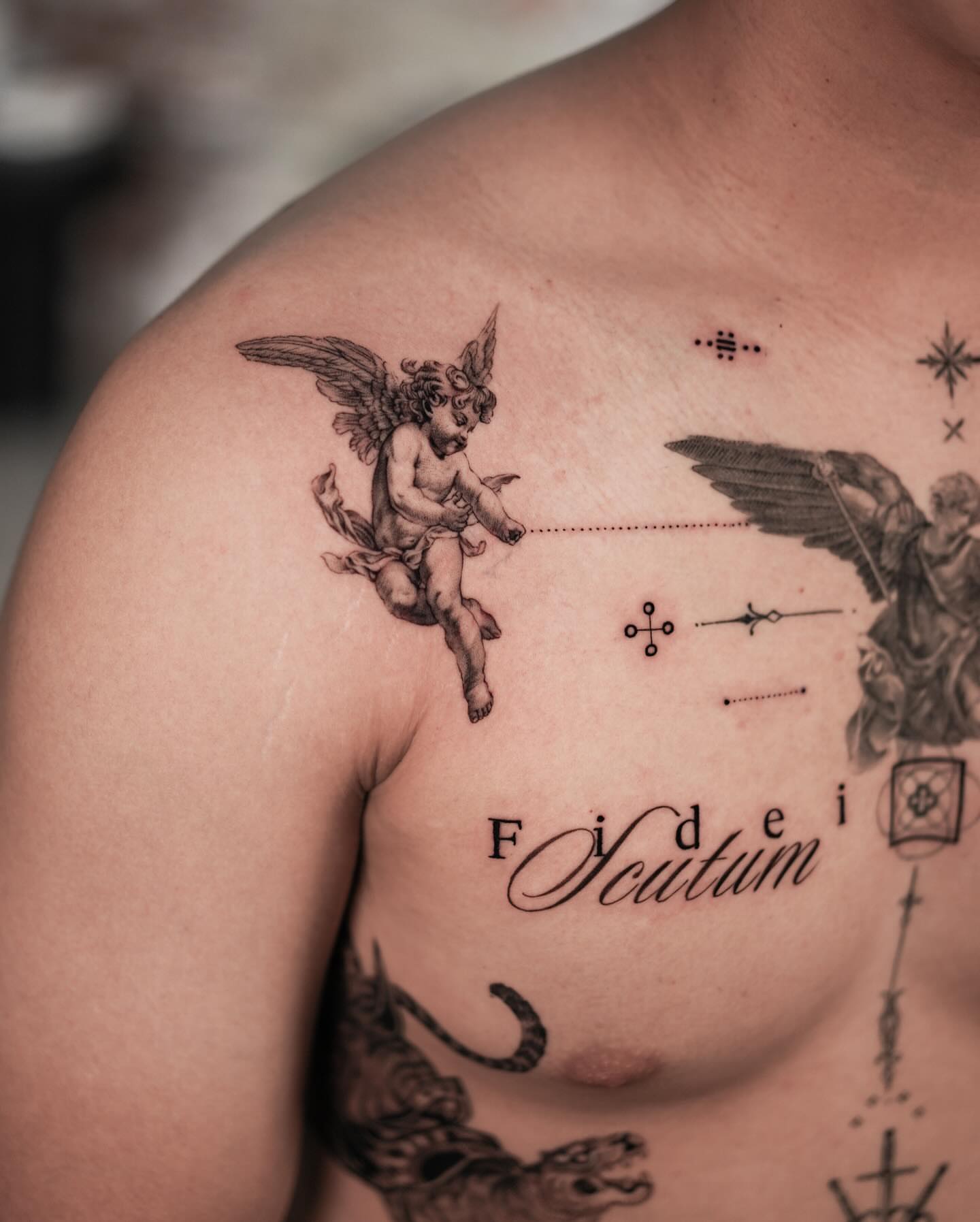 Cherub and angel black and grey tattoo on the chest by Jinzhi ye