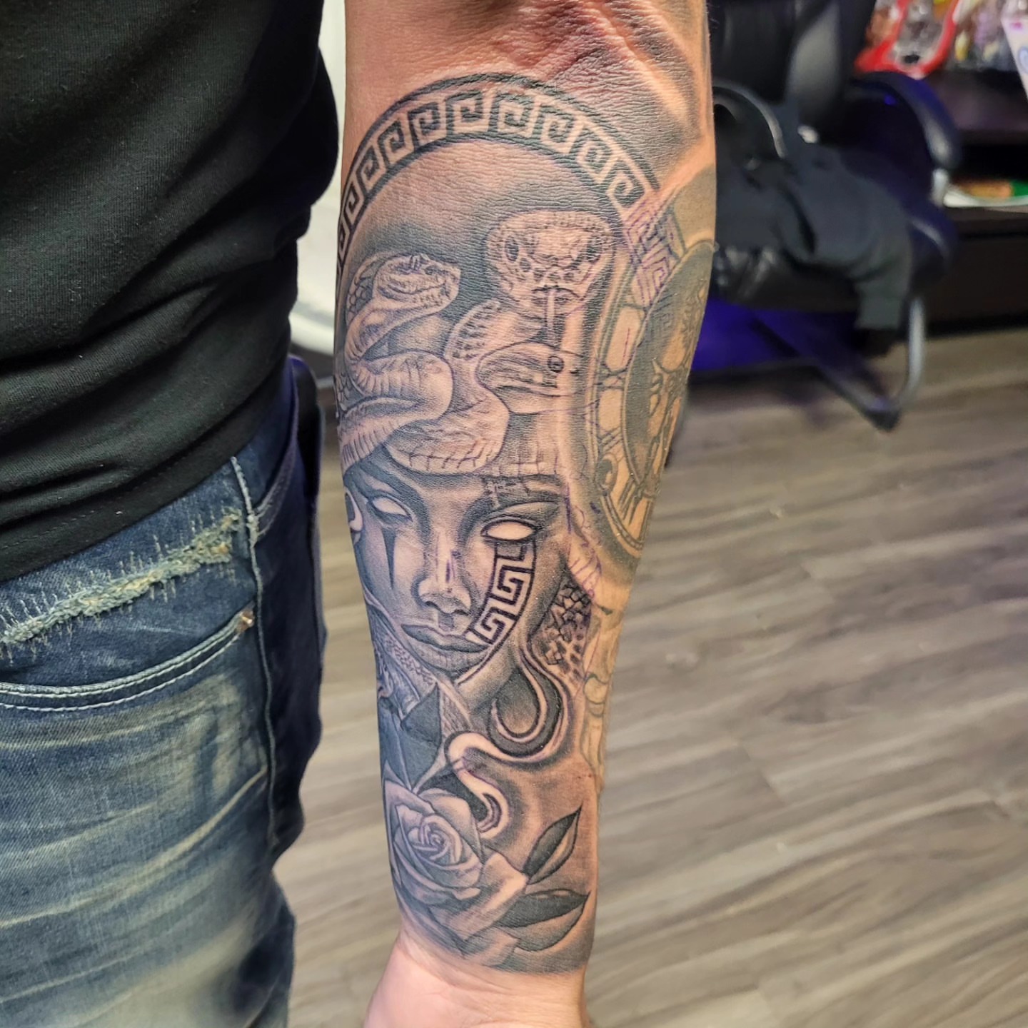 Woman's face with snakes geometric tattoo on the forearm by Beto Tats, Round Rock, Texas