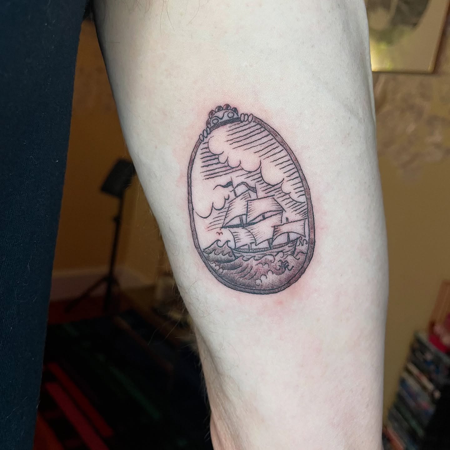 Ship in storm black and grey tattoo on the forearm by Steph Liebetreu