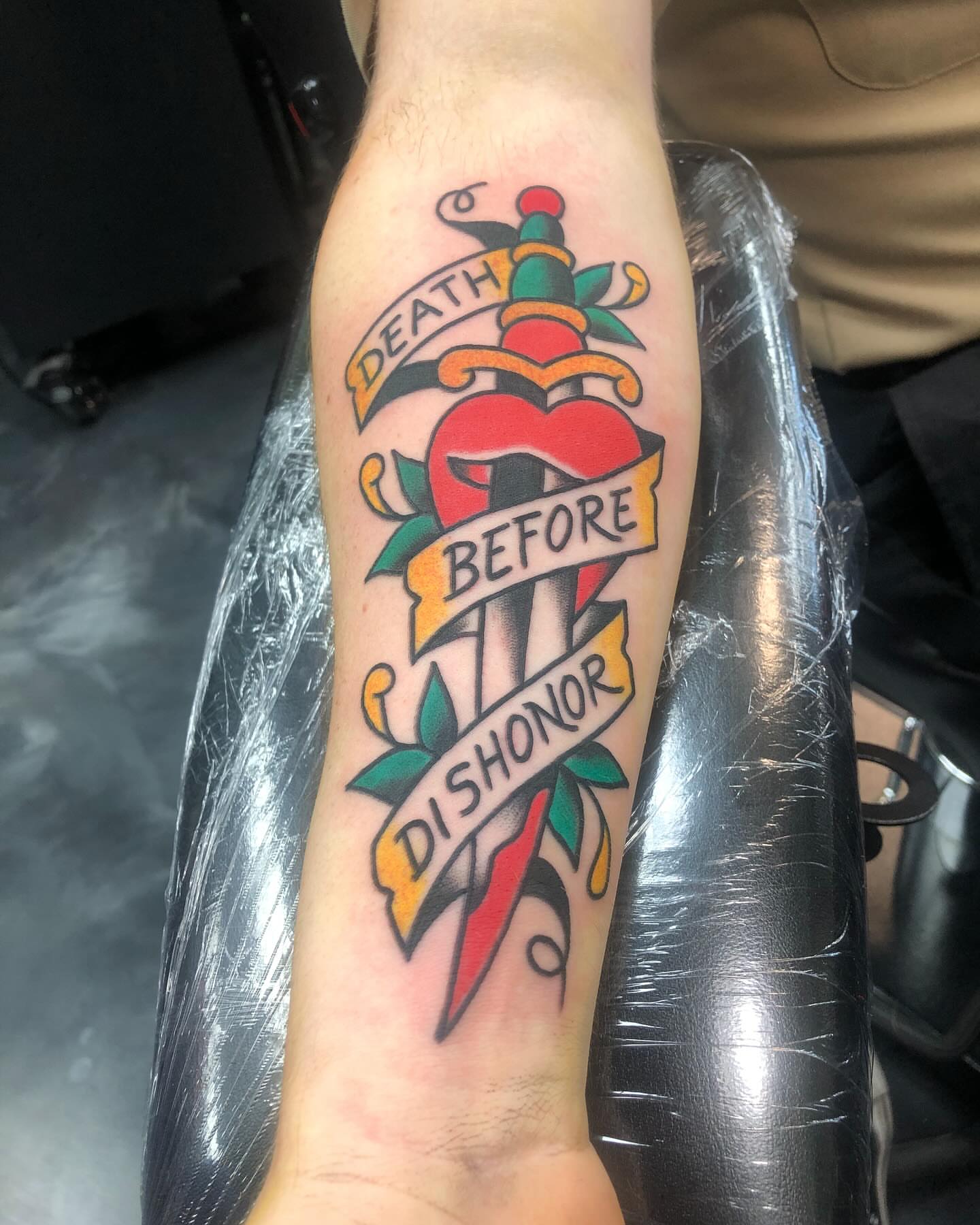 Sword and heart American traditional tattoo on the forearm by Brent G