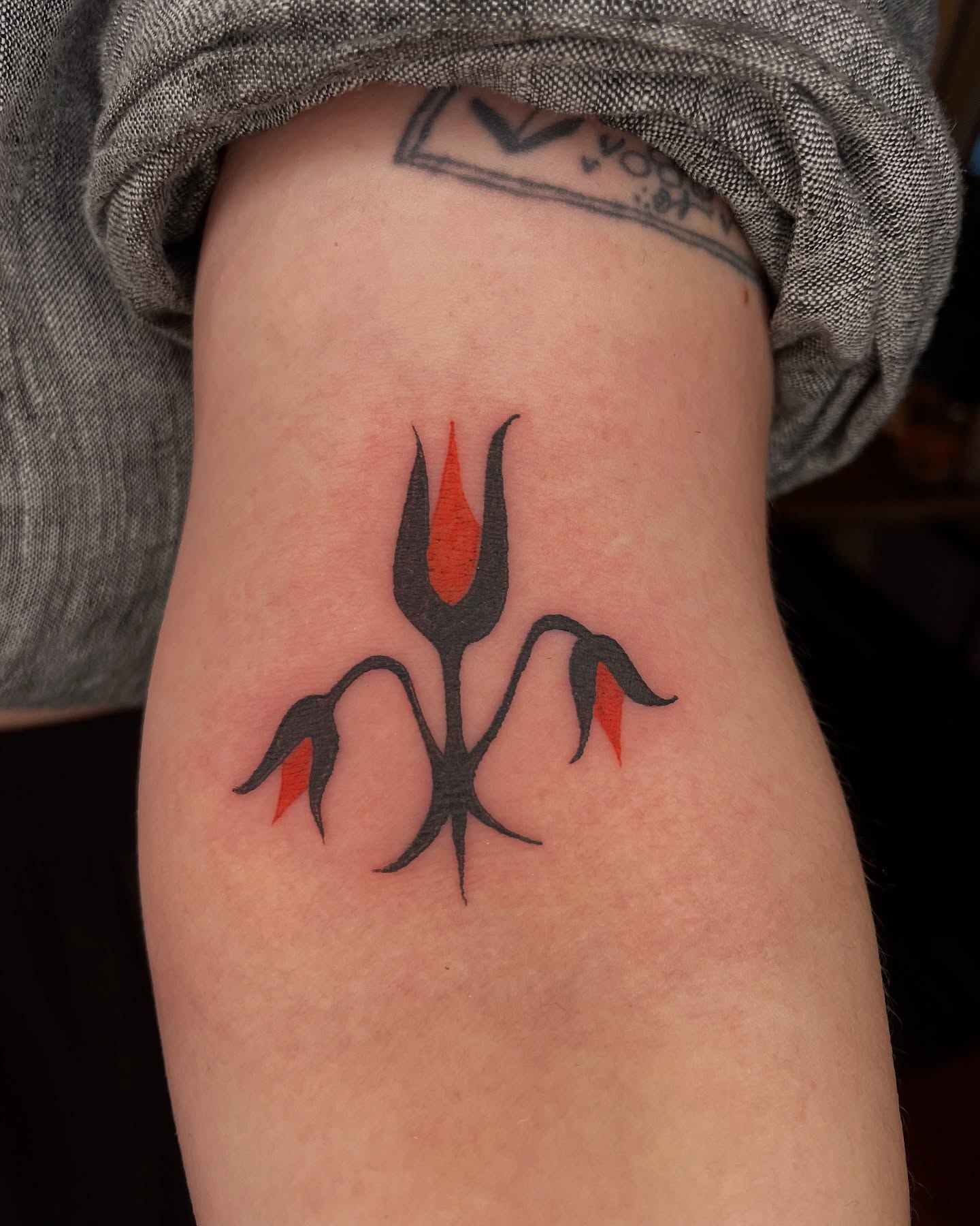 Flame-like plant geometric tattoo on the forearm by Steph Liebetreu