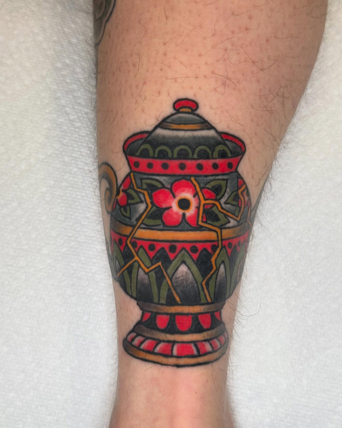 Vase with floral design American traditional tattoo on the forearm by Seth Walker