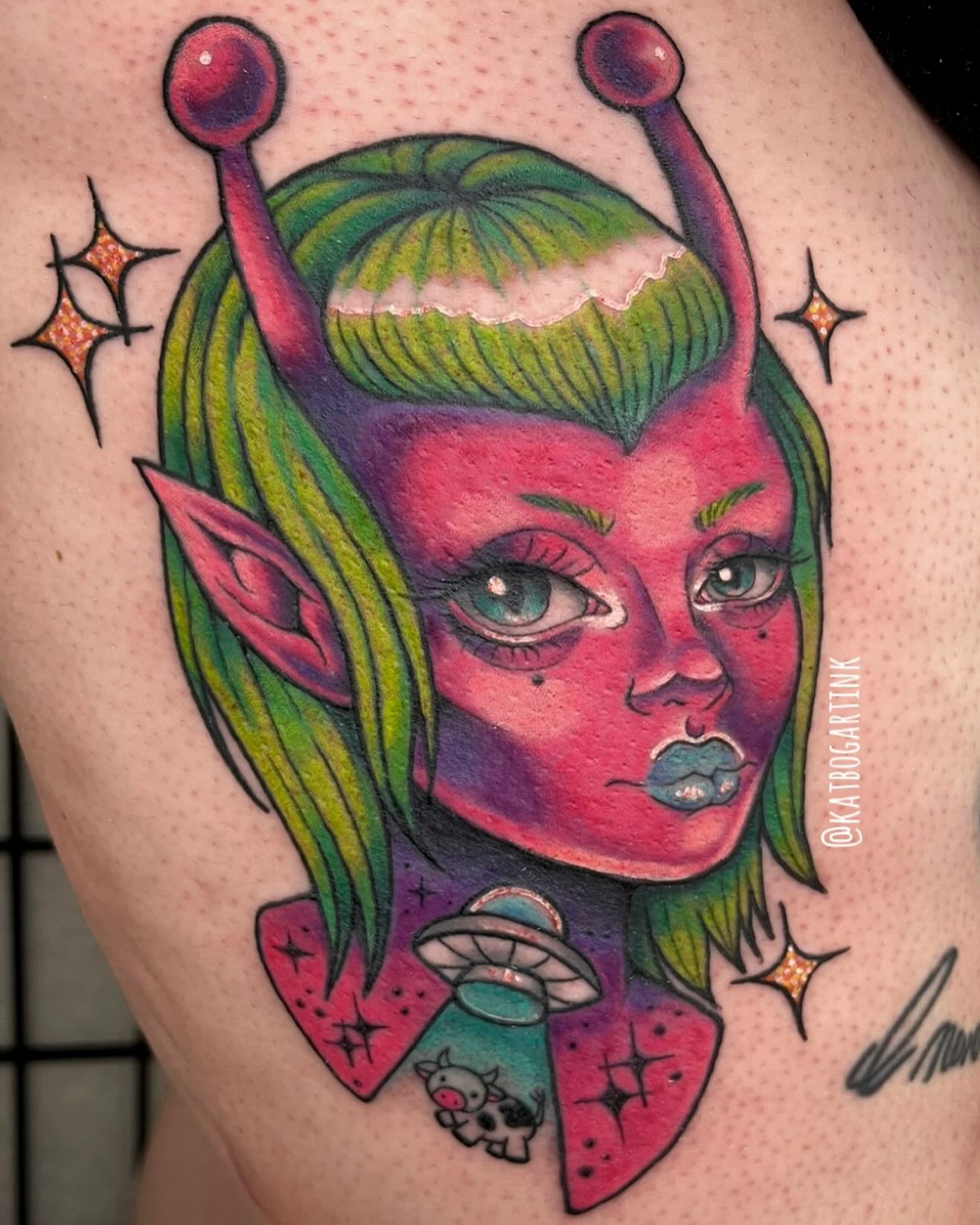 Alien girl illustrative tattoo on the thigh by Kat (Scout) Bogart