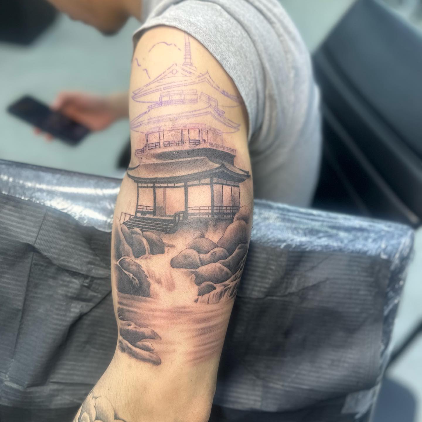 Japanese pagoda realism tattoo on the forearm by Angela Azure
