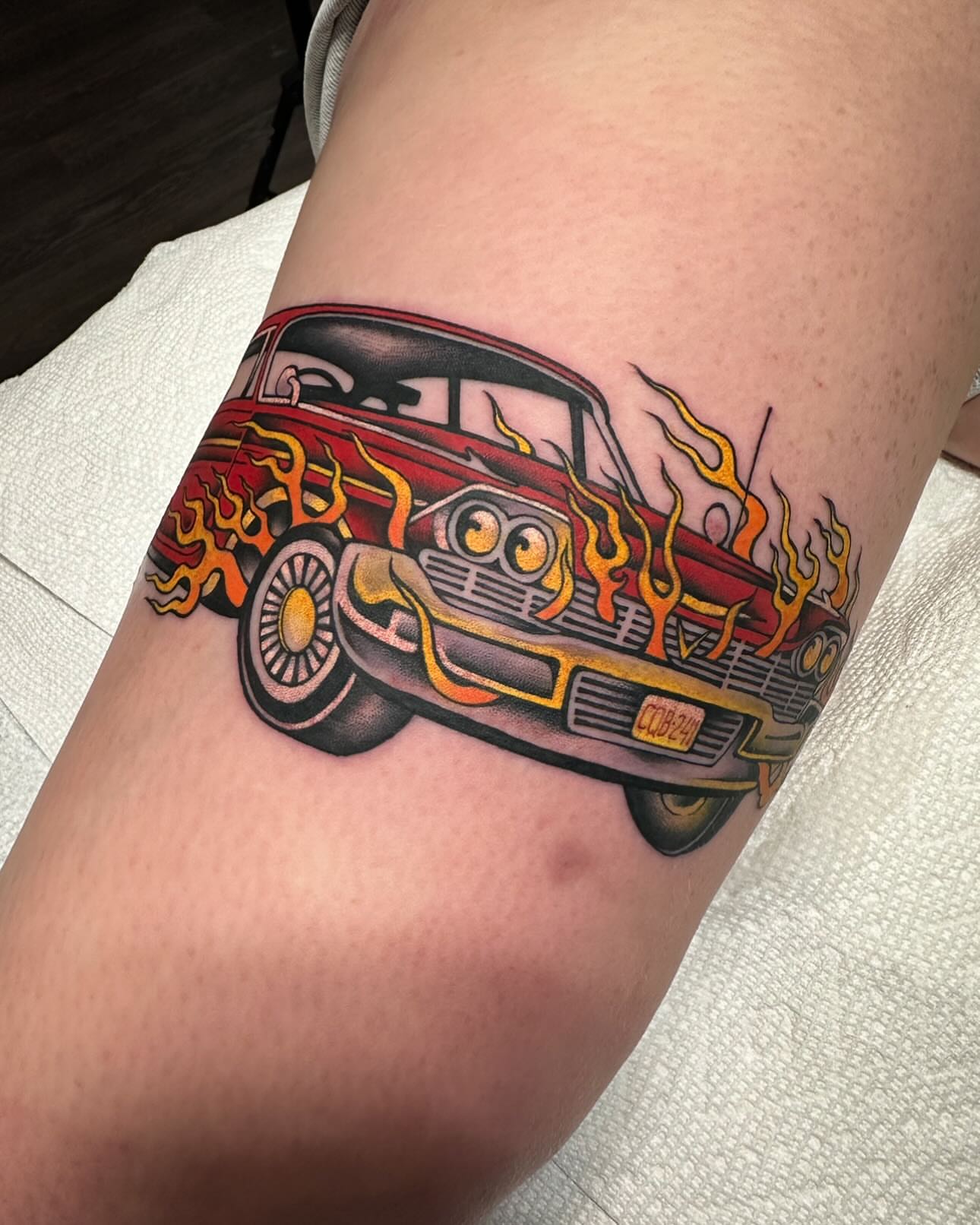 Hot rod American traditional tattoo on the thigh by Mark Boller