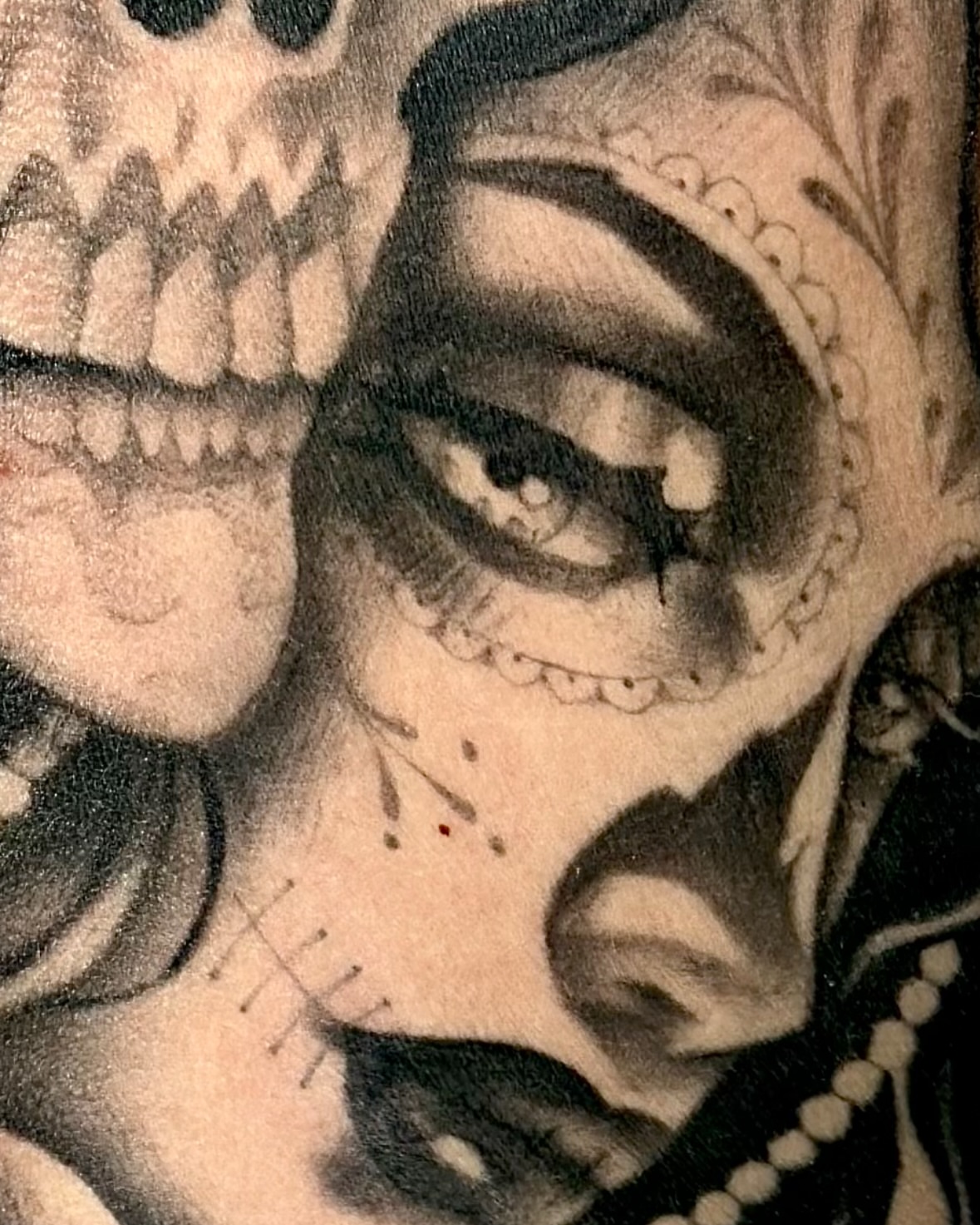 Sugar skull black and grey tattoo on the head by Feliz Manzanedo, Prescott, Arizona