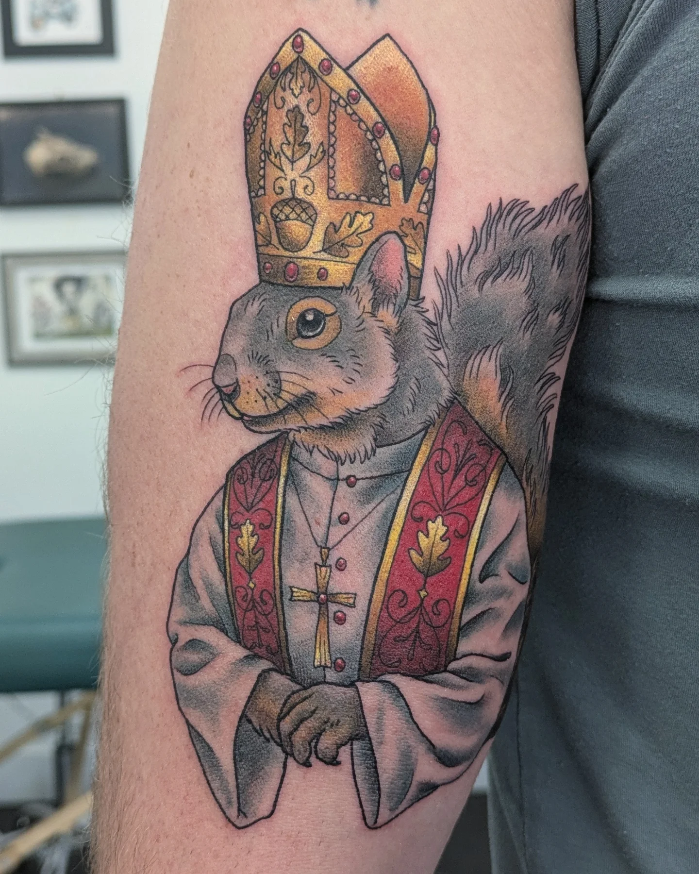 Squirrel in bishop attire realism tattoo on the forearm by Christel Perkins