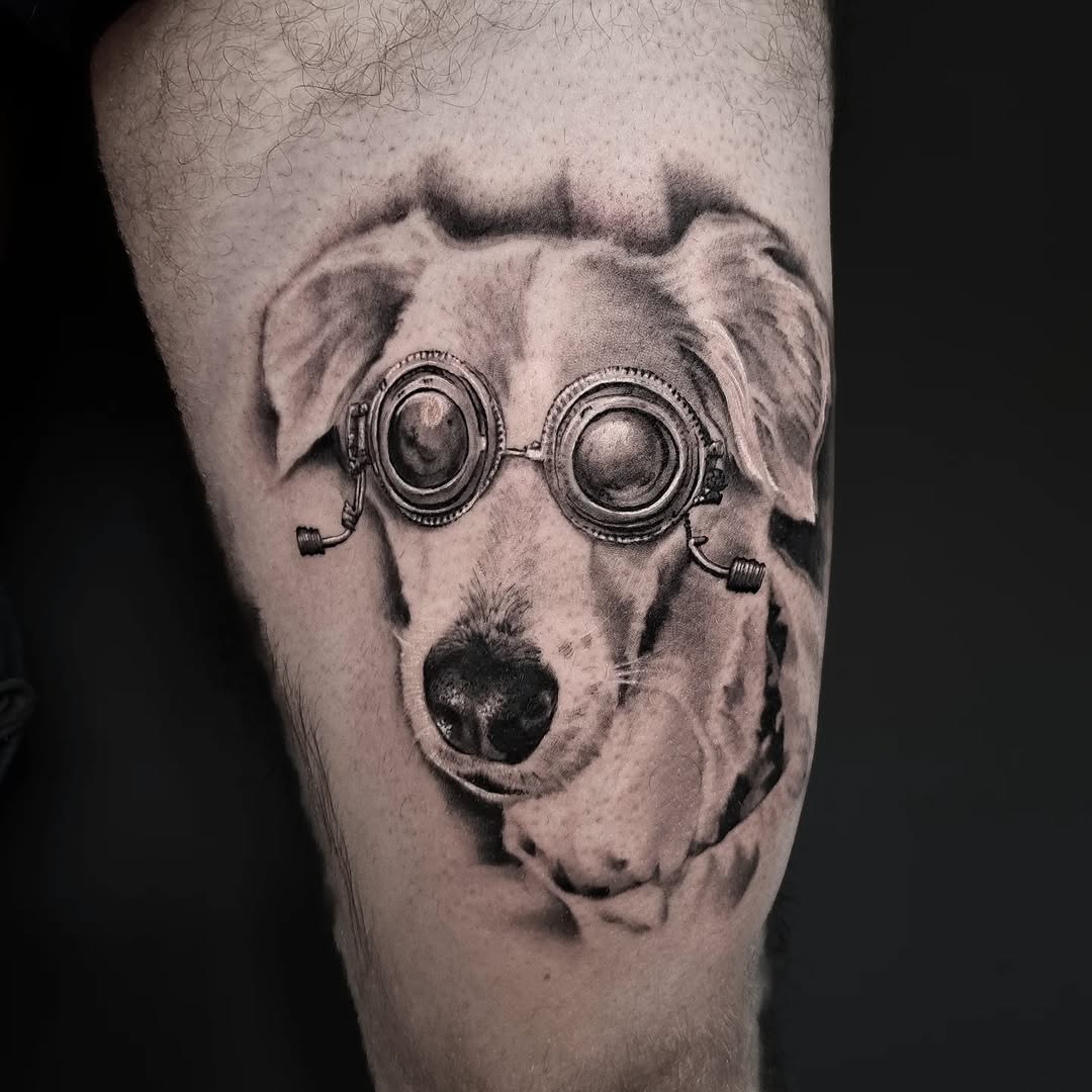 Dog wearing goggles realism tattoo on the forearm by Lindsay