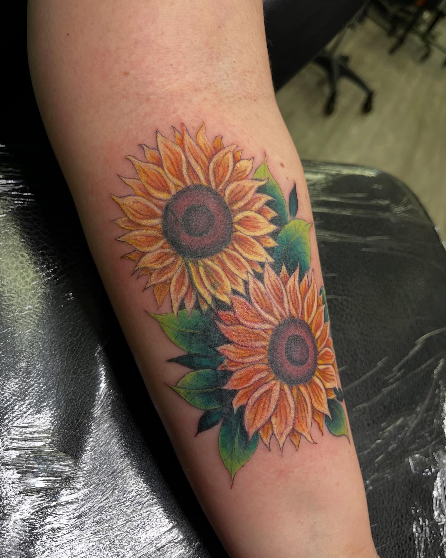 Sunflowers realism tattoo on the forearm by Tattoos by Gina Palladino
