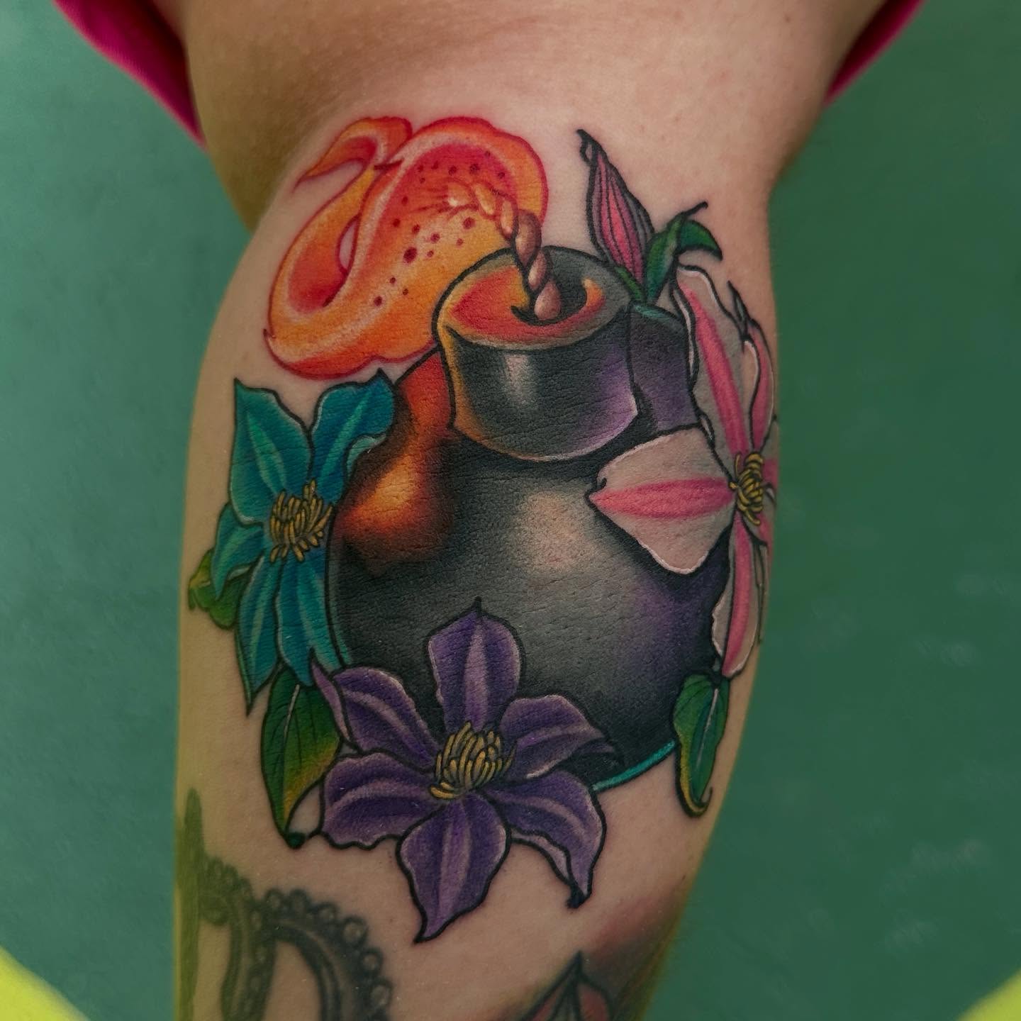 Candle and flowers American traditional tattoo on the forearm by Holle Hellfire