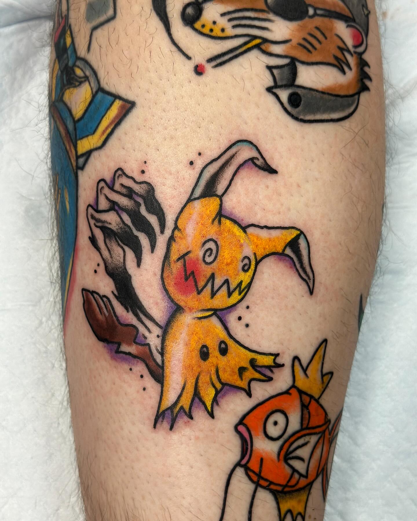 Abstract creatures American traditional tattoo on the forearm by Olive Kelley