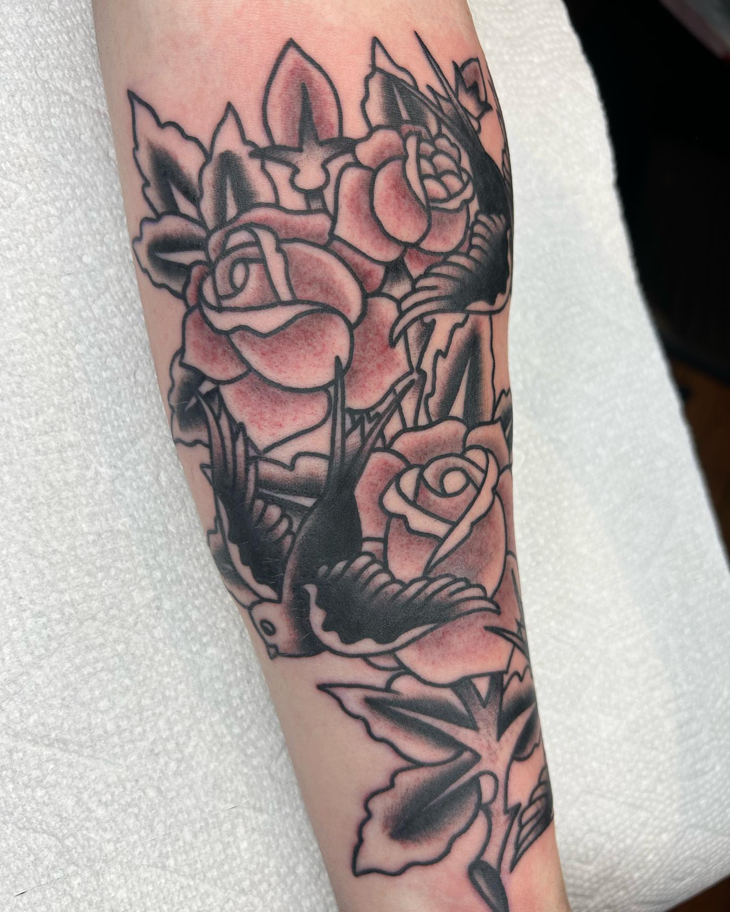 Roses American traditional tattoo on the forearm by Alex Lang
