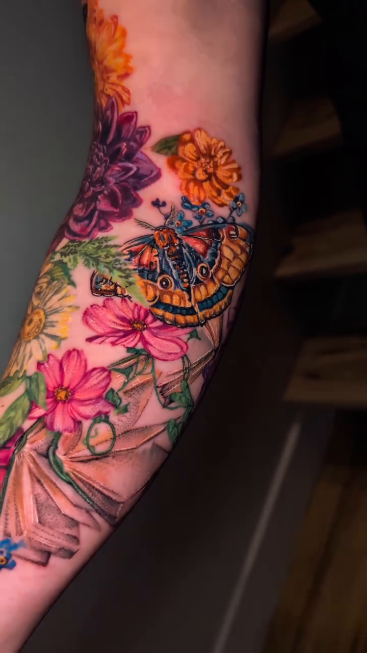 Butterfly and flowers neo-traditional tattoo by Colorful Tattoos by Cody Dean